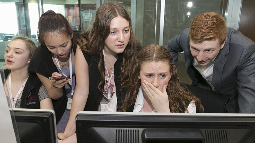 High school students using terminals in the Hanlon Lab at Stevens during Trading Day.