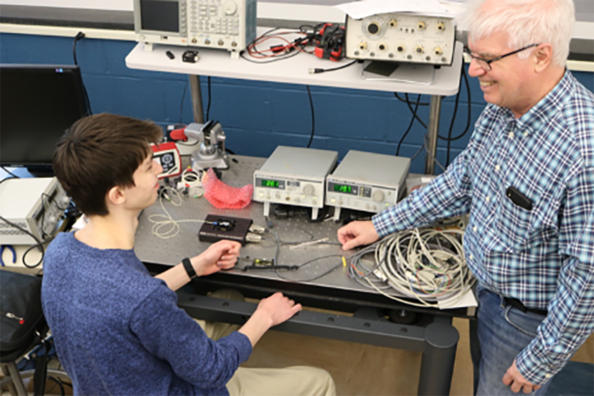 Photo of Ed Whittaker and a student
