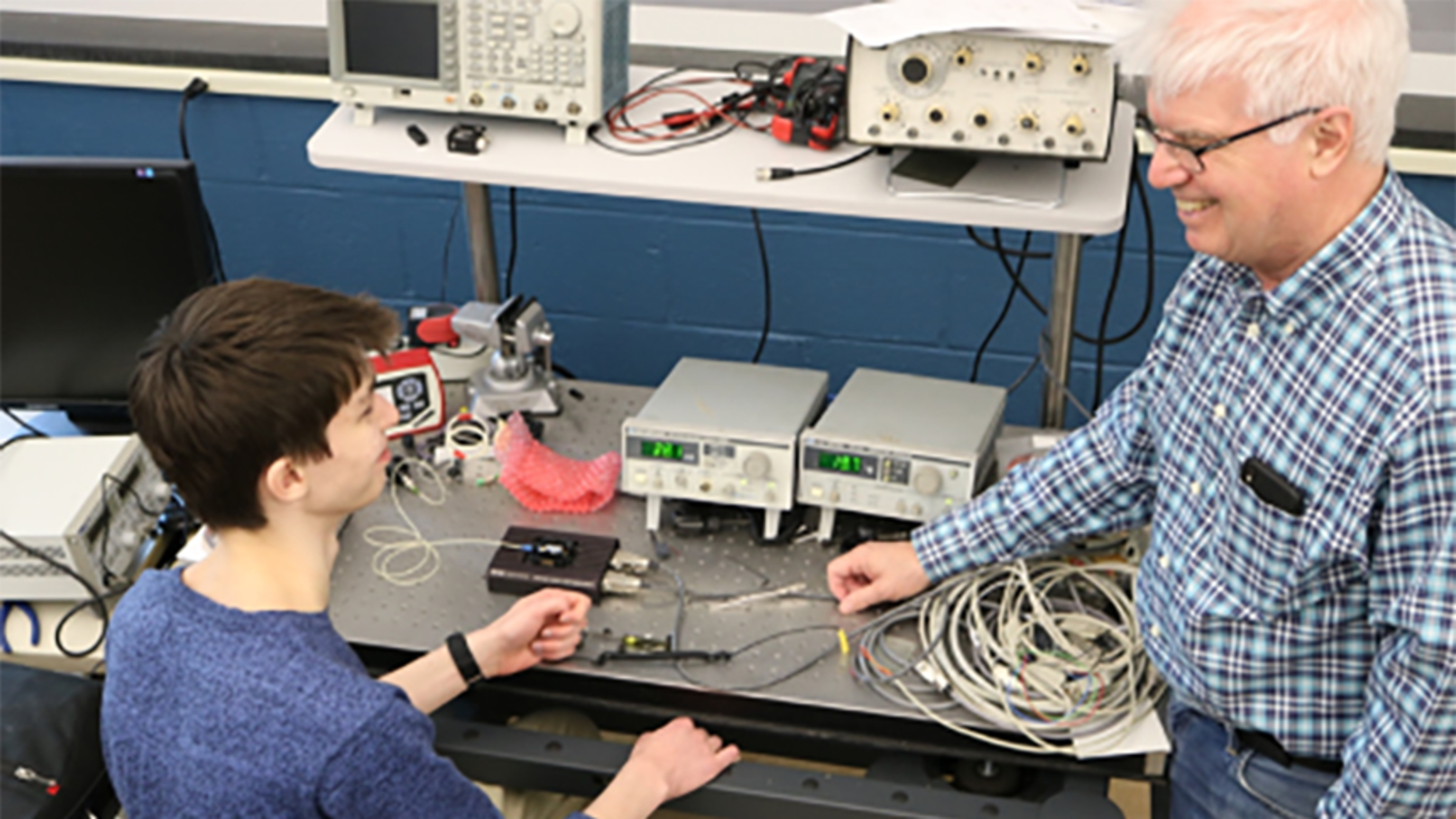 Photo of Ed Whittaker and a student