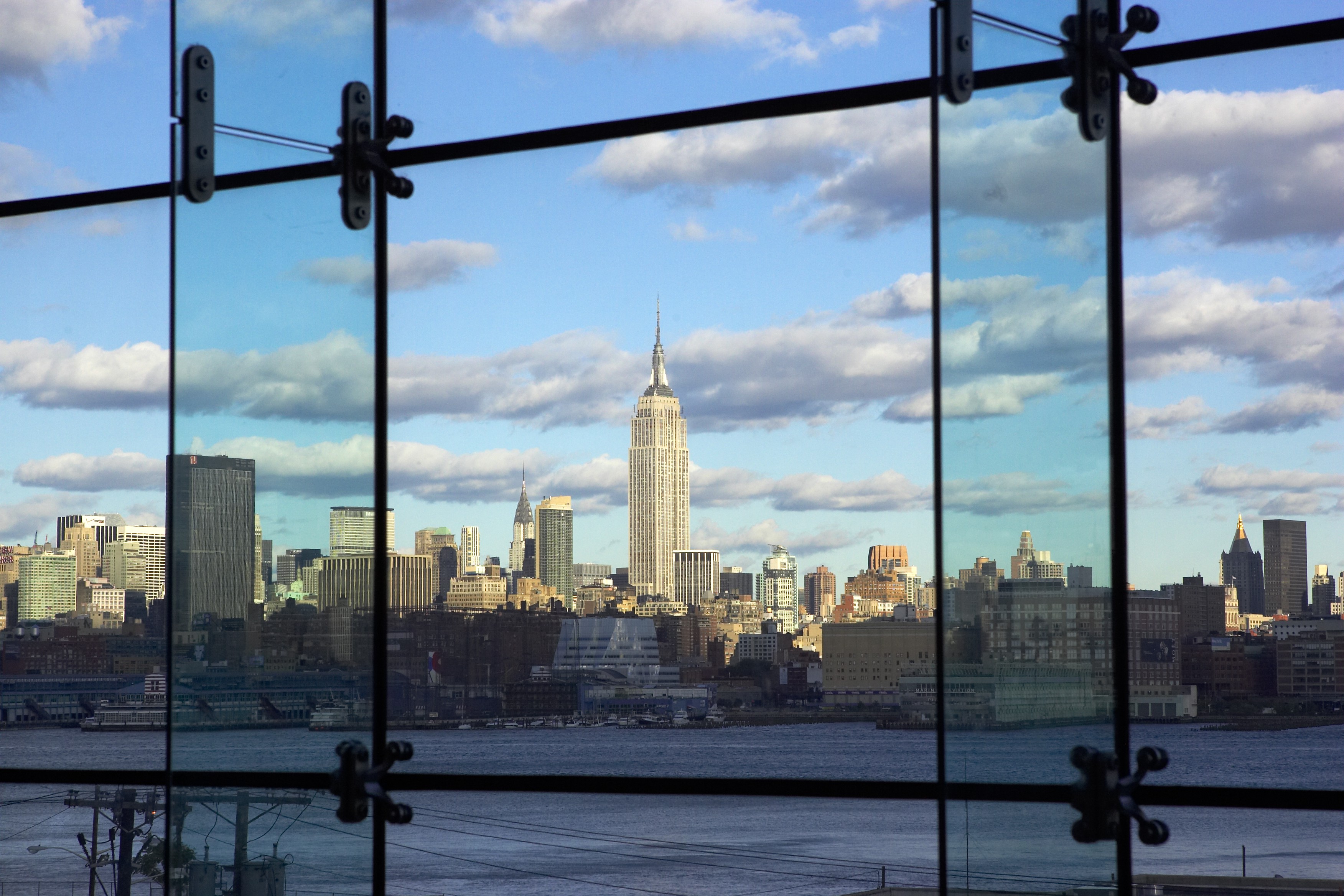 A view of lower Manhattan's skyline from Babbio's atrium. The shot is taken from inside the atrium, which consists of floor to ceiling windows.