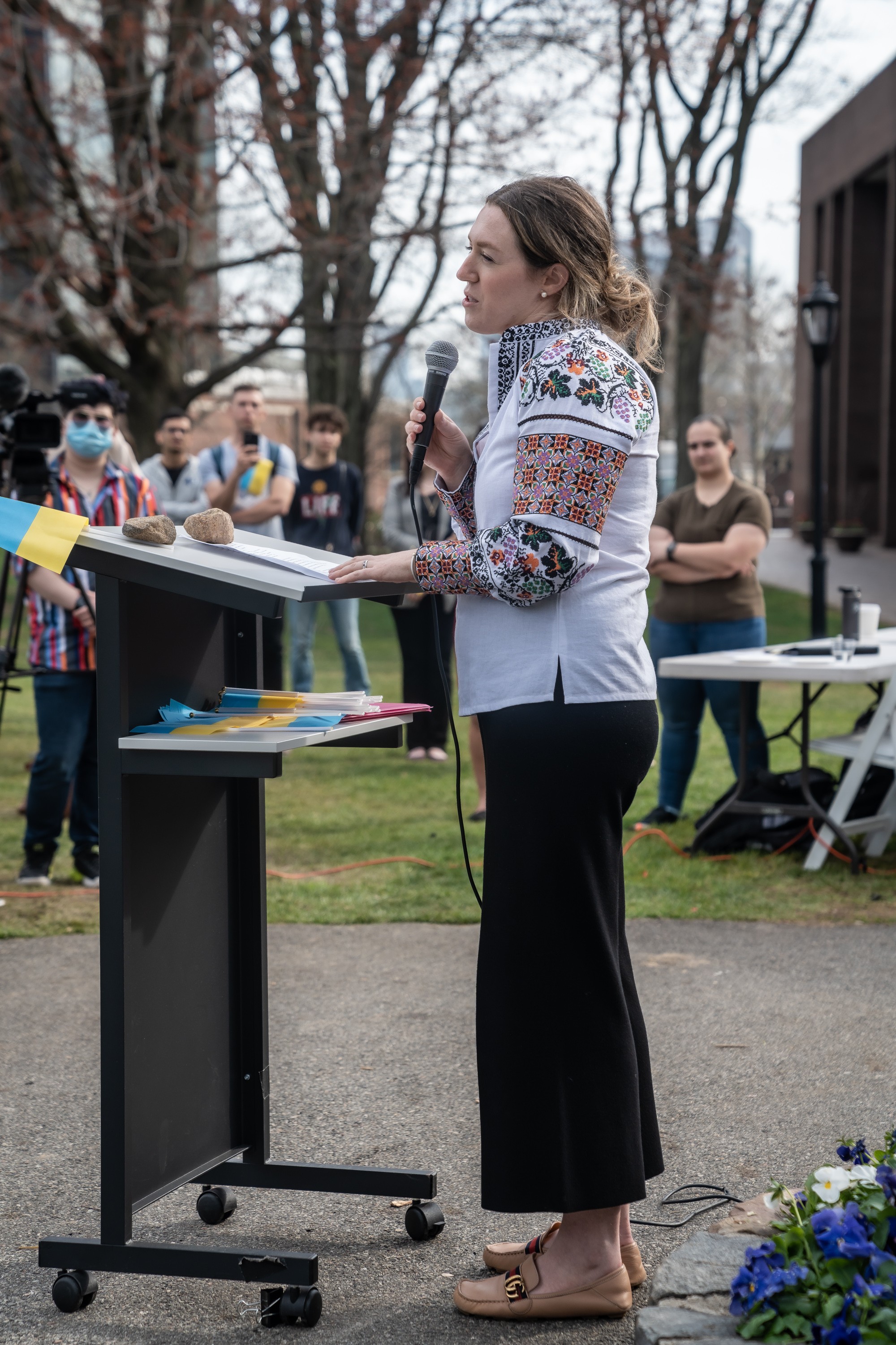Nicole Malantchouk speaking in microphone at the Stevens Rally for Ukraine