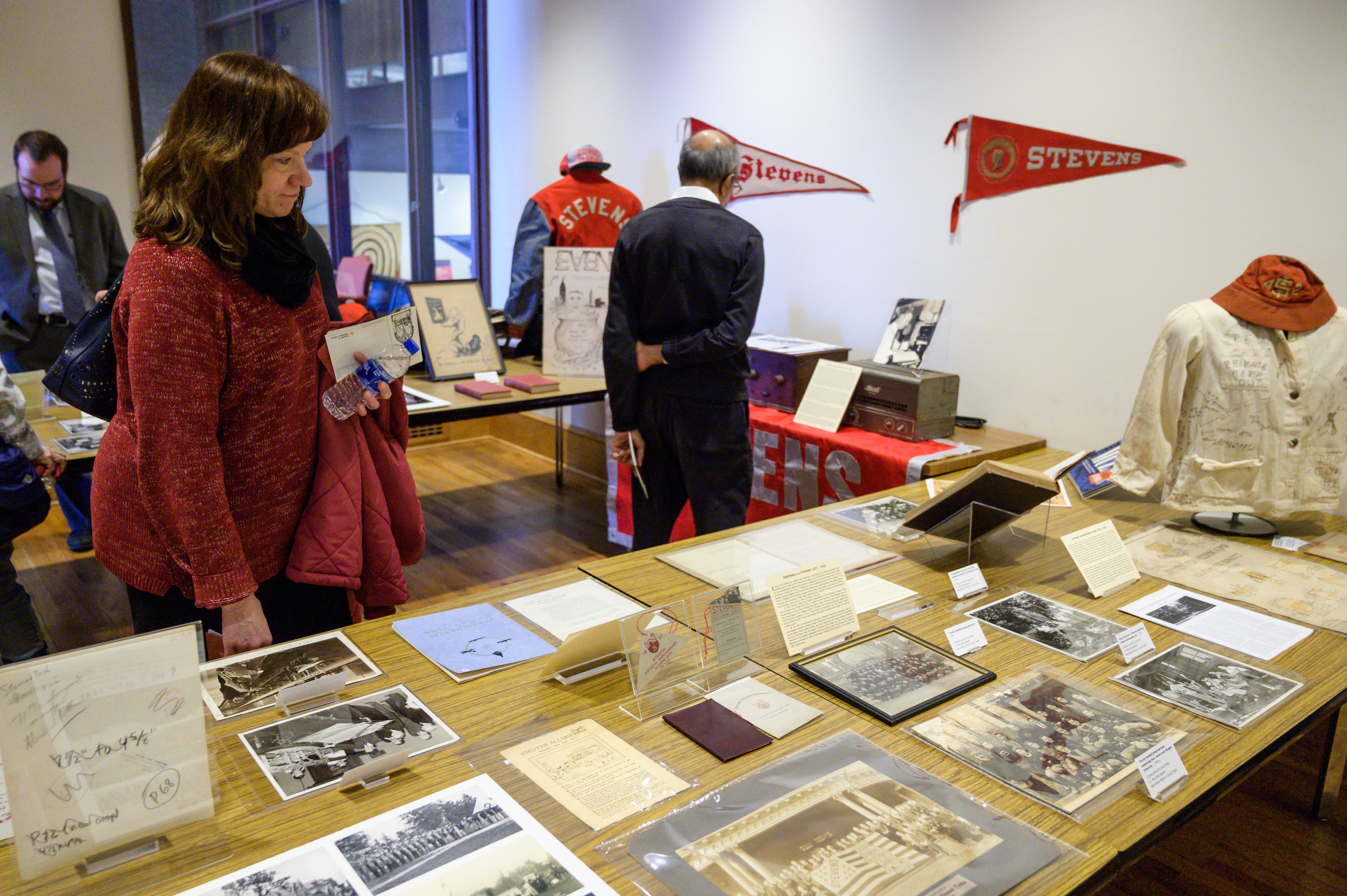 Stevens artifacts displayed on a table in the library exhibit. 
