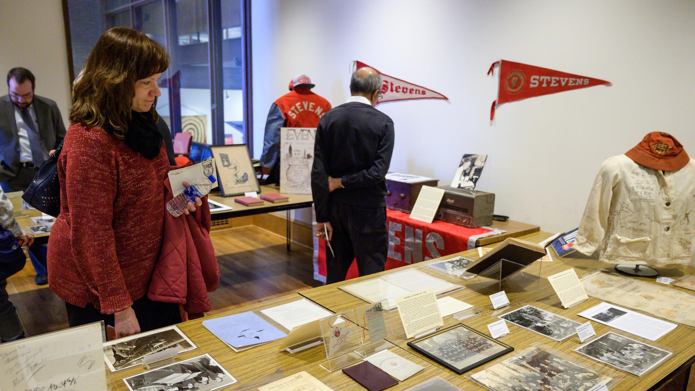 Stevens artifacts displayed on a table in the library exhibit.