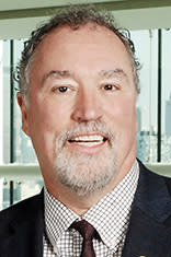 Headshot of Dr. Donald Lombardi with the New York skyline in the background.