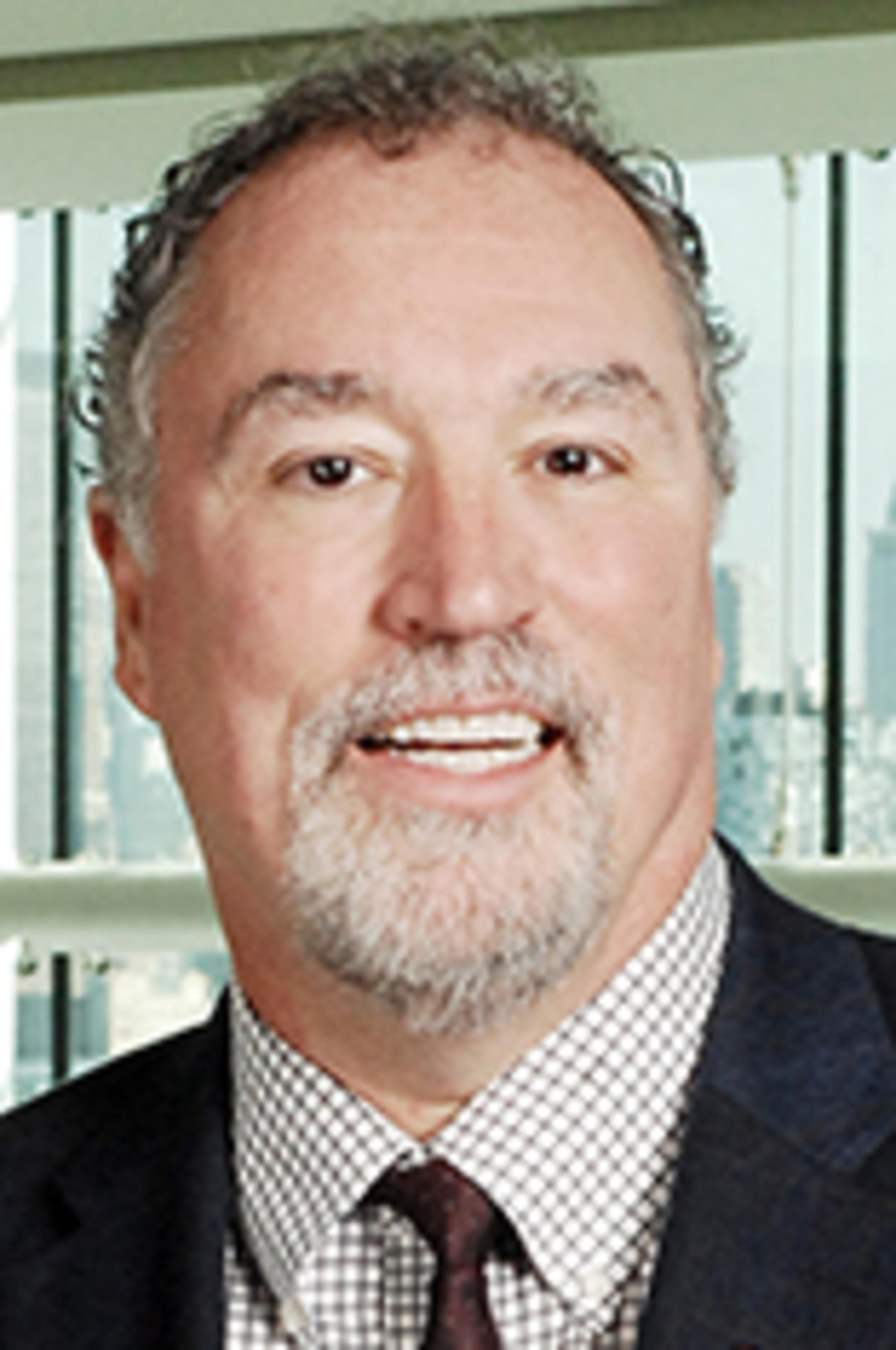 Headshot of Dr. Donald Lombardi with the New York skyline in the background.