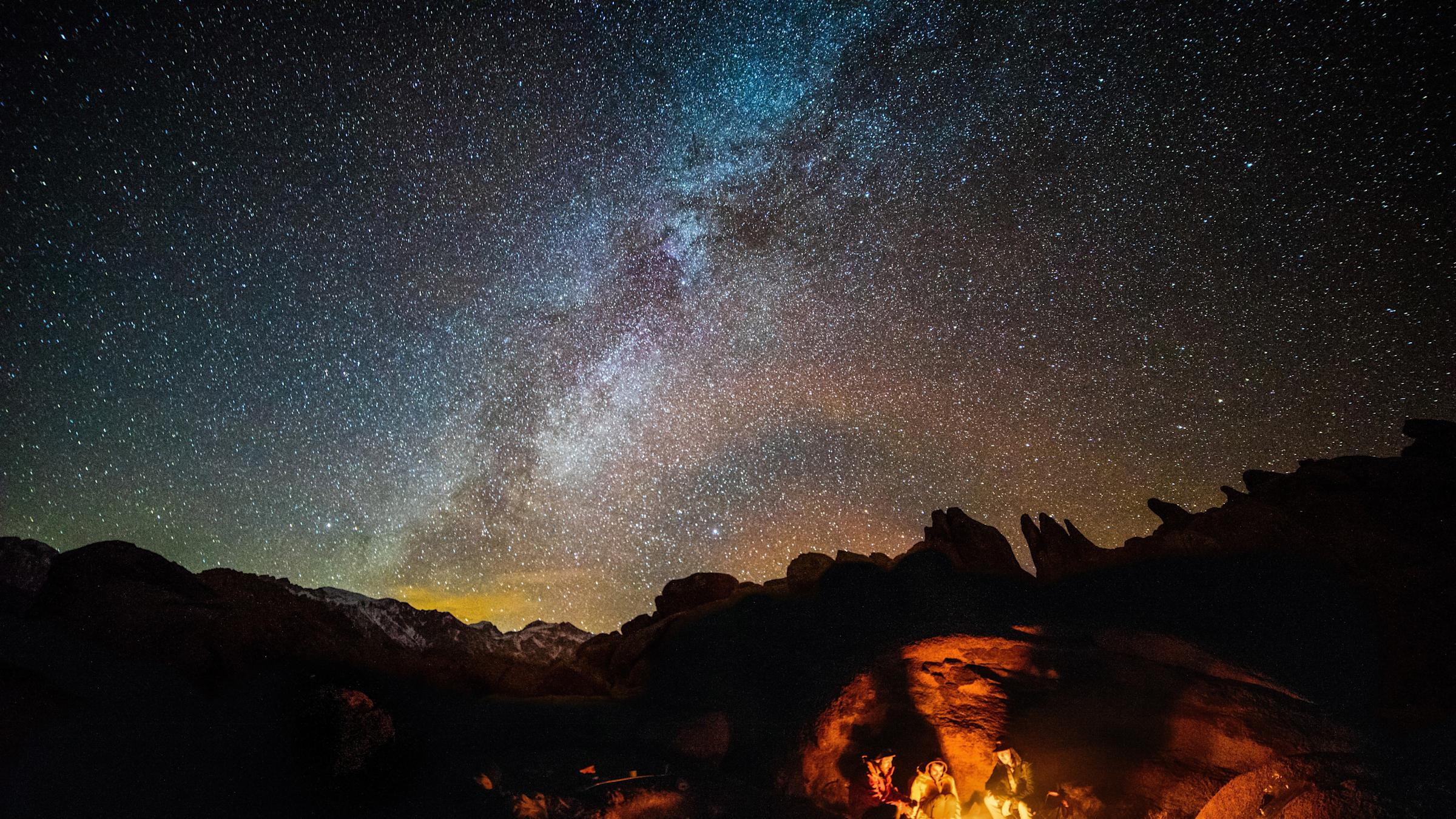 photo of people camping under the stars