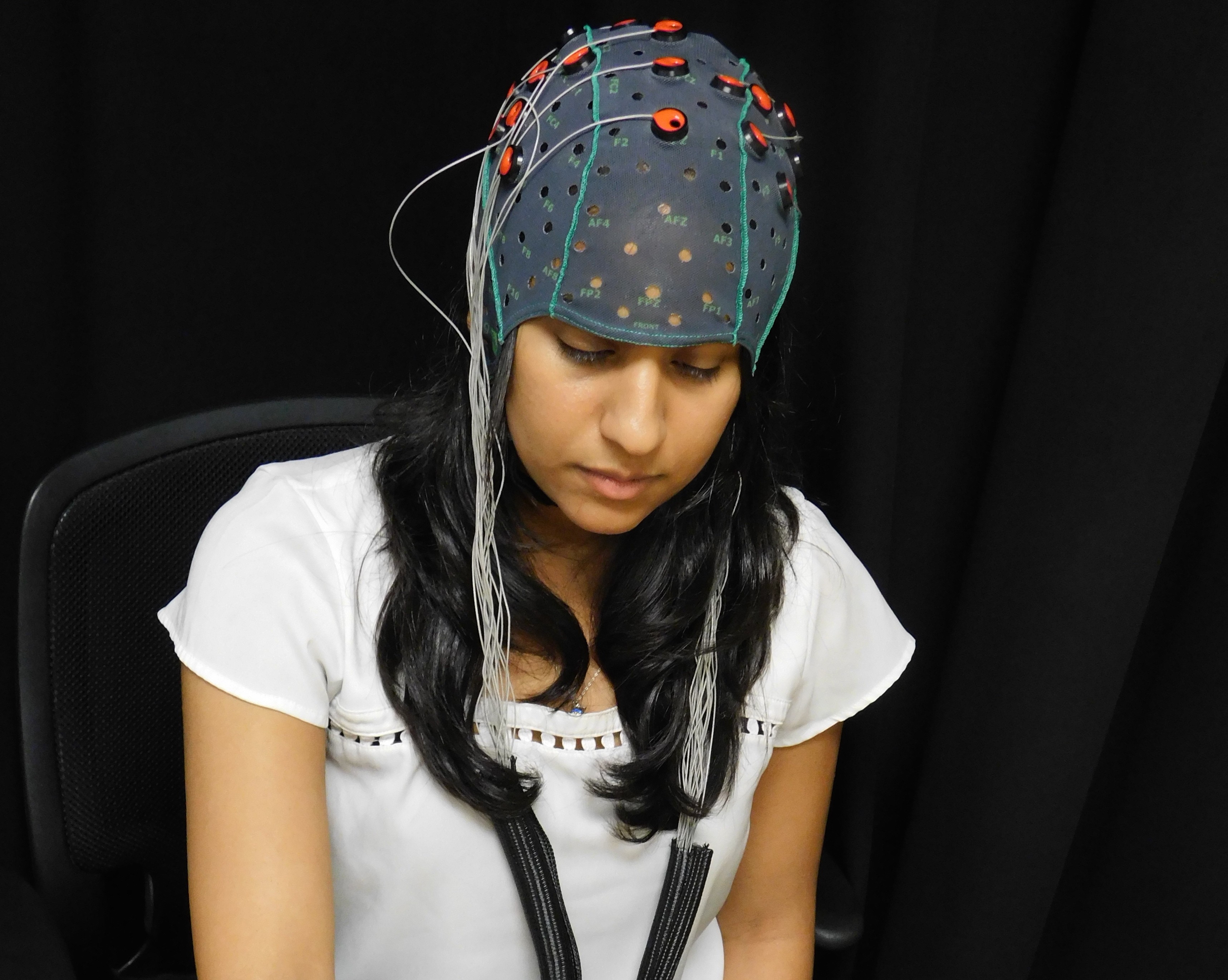 Vrajeshri Patel demonstrates her neural recording cap