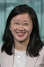 Headshot of Dr. Ying Wu with New York City in the background.