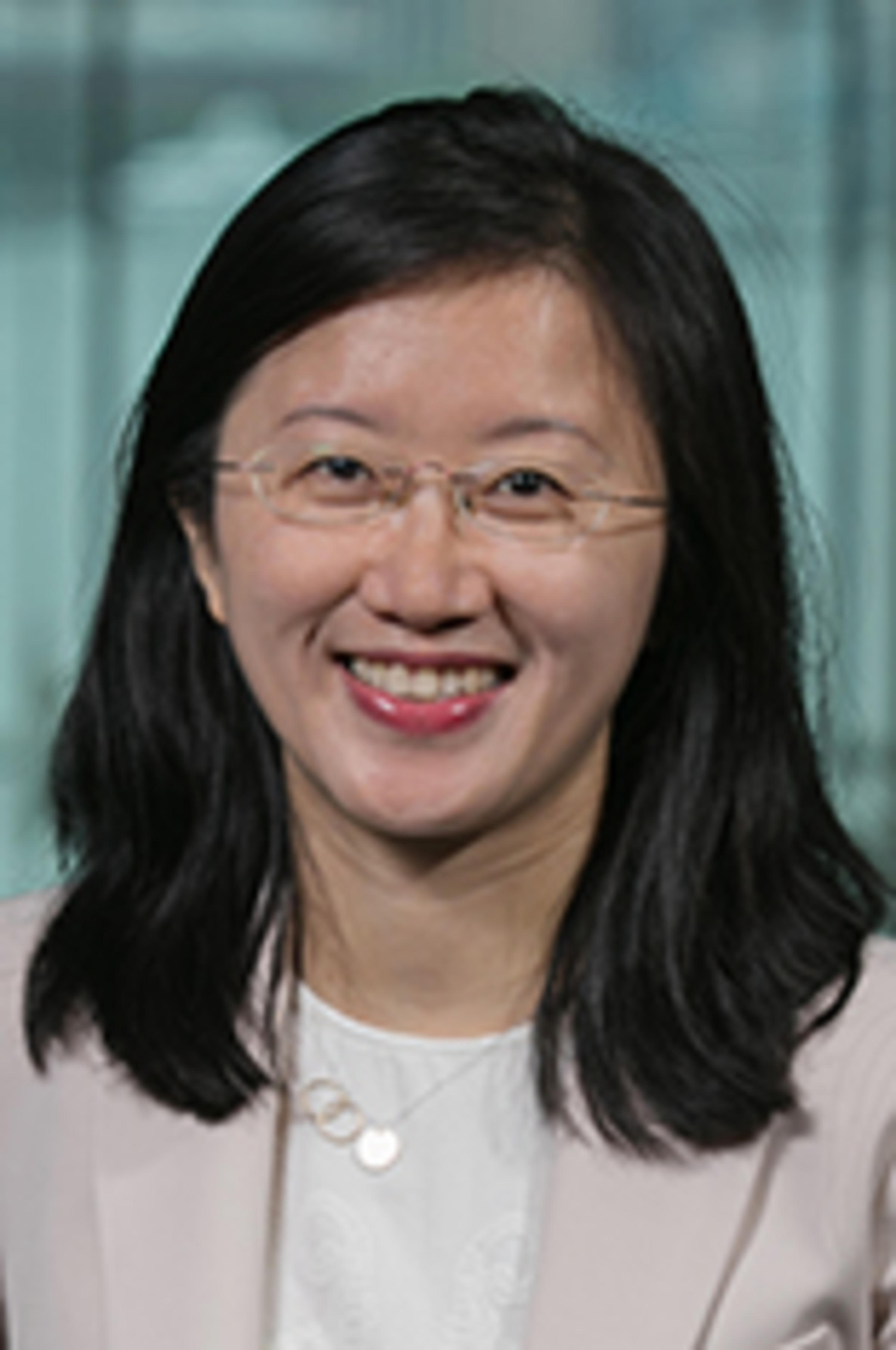 Headshot of Dr. Ying Wu with New York City in the background.