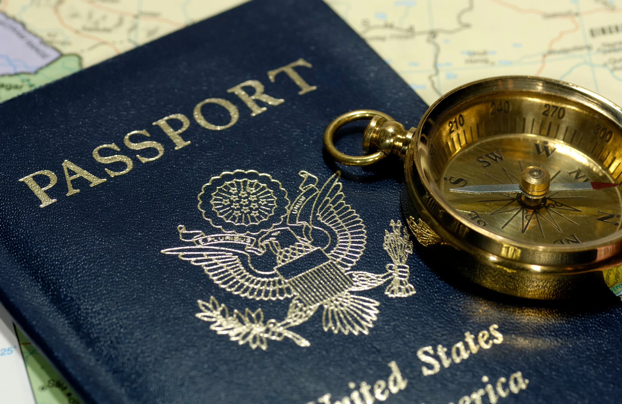 Passport, compass, and map