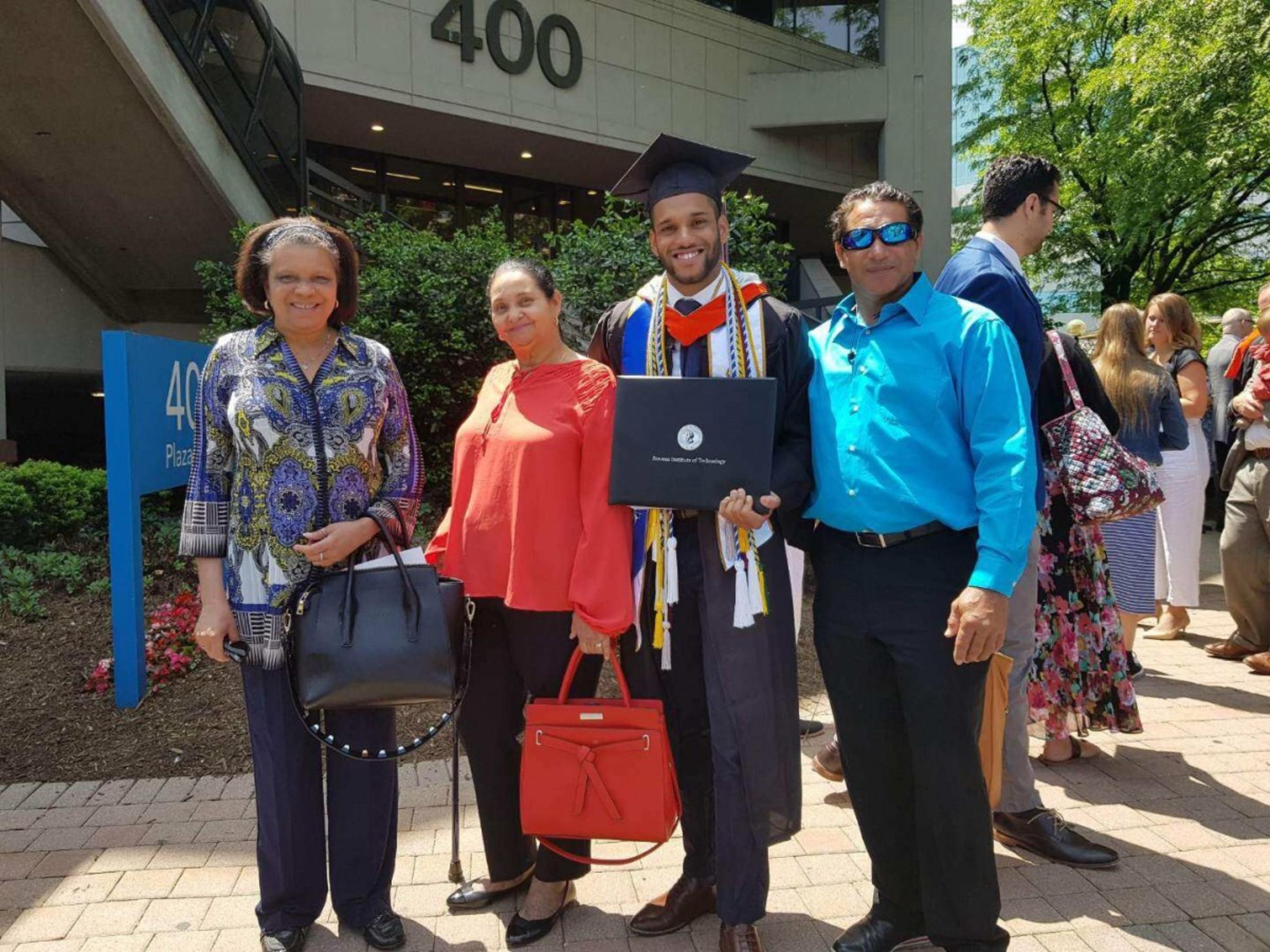 Jose Angeles-Ovalles posing with his family outside the Meadowlands Expo Center