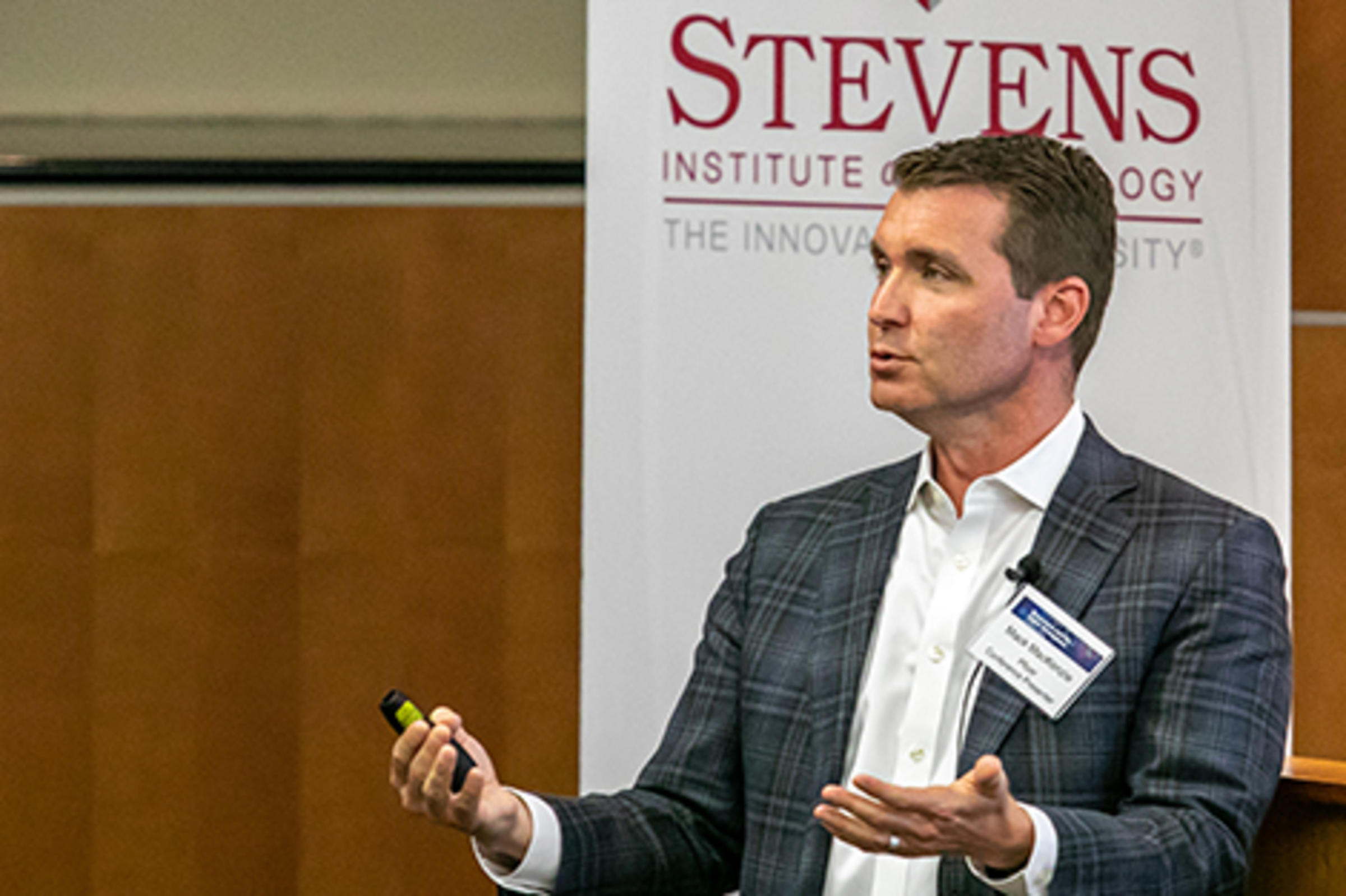 Mack MacKenzie at a Stevens podium.