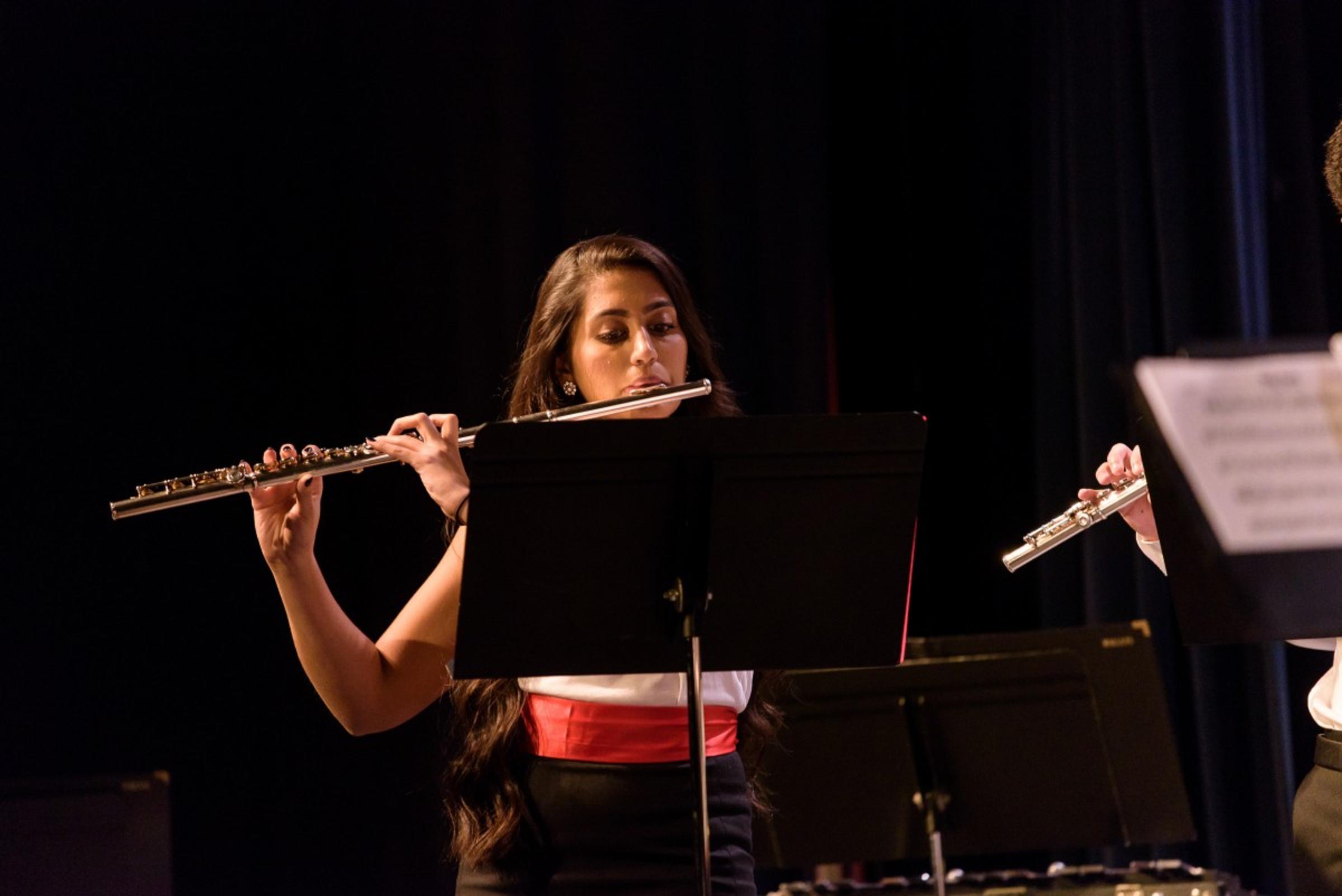 Moenika Chowdhury playing the flute