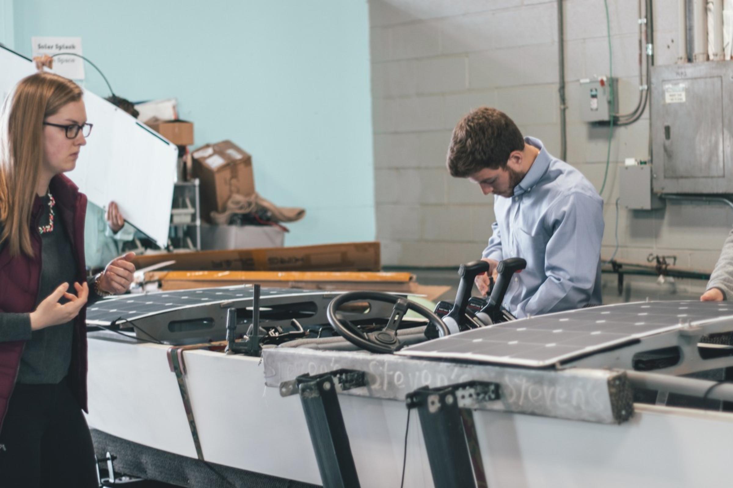 Poor and Lassi working on the boat