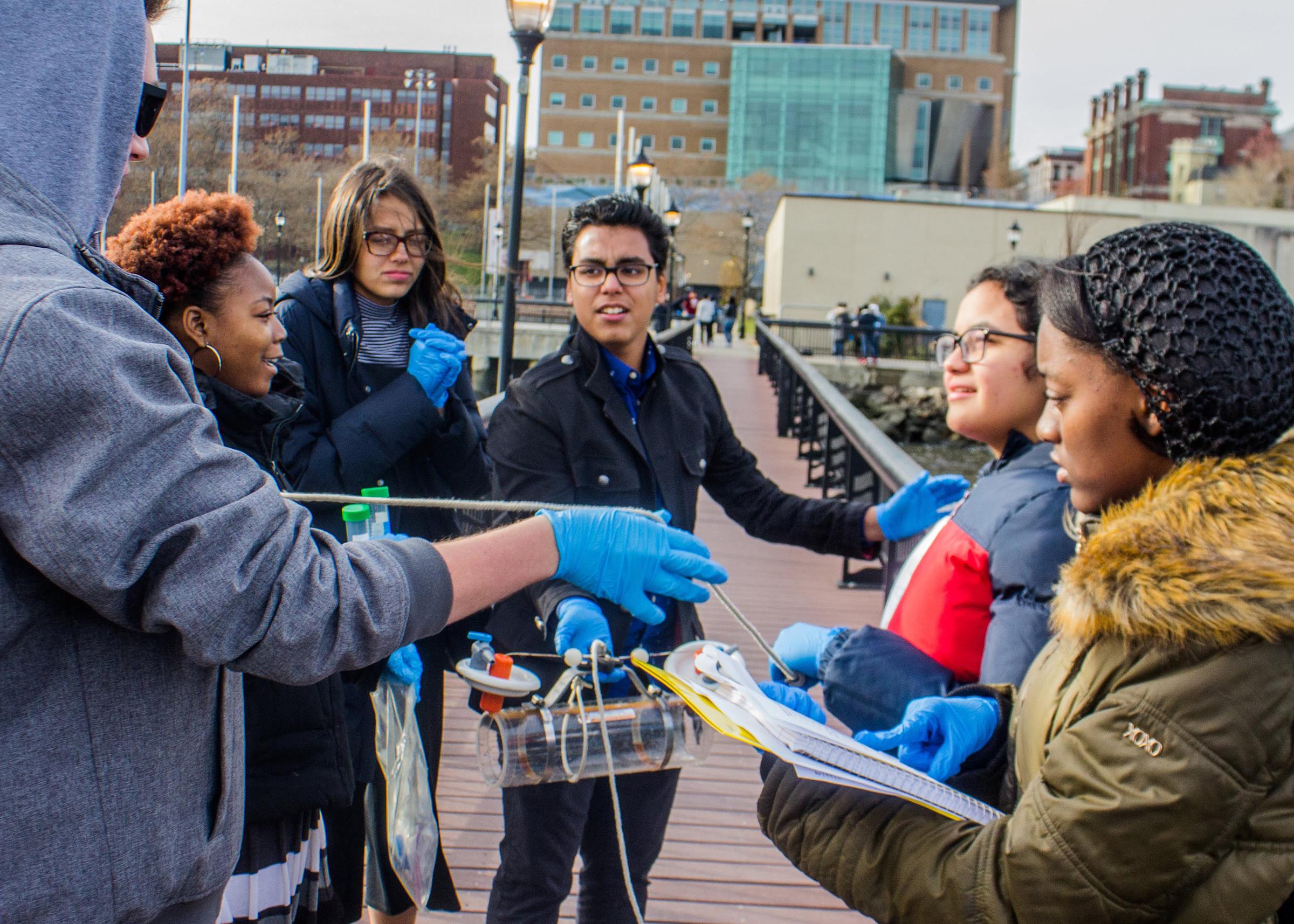 Students outside conducting a science project.