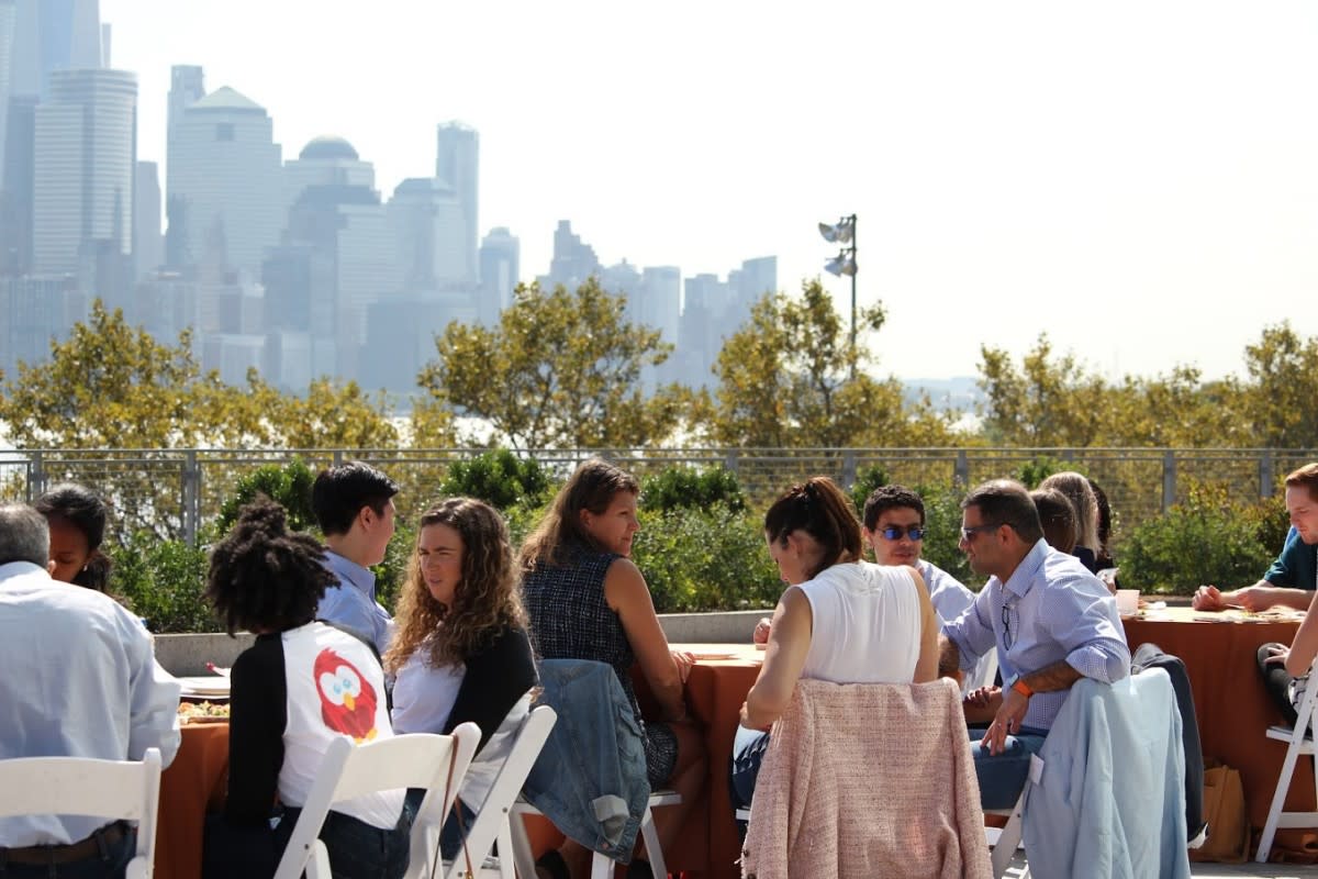 recruiters are seated at tables on the outdoor plaza just outside Babbio Center, across from Manhattan