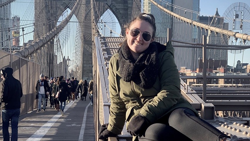 Devon Leslie poses on the Brooklyn Bridge.