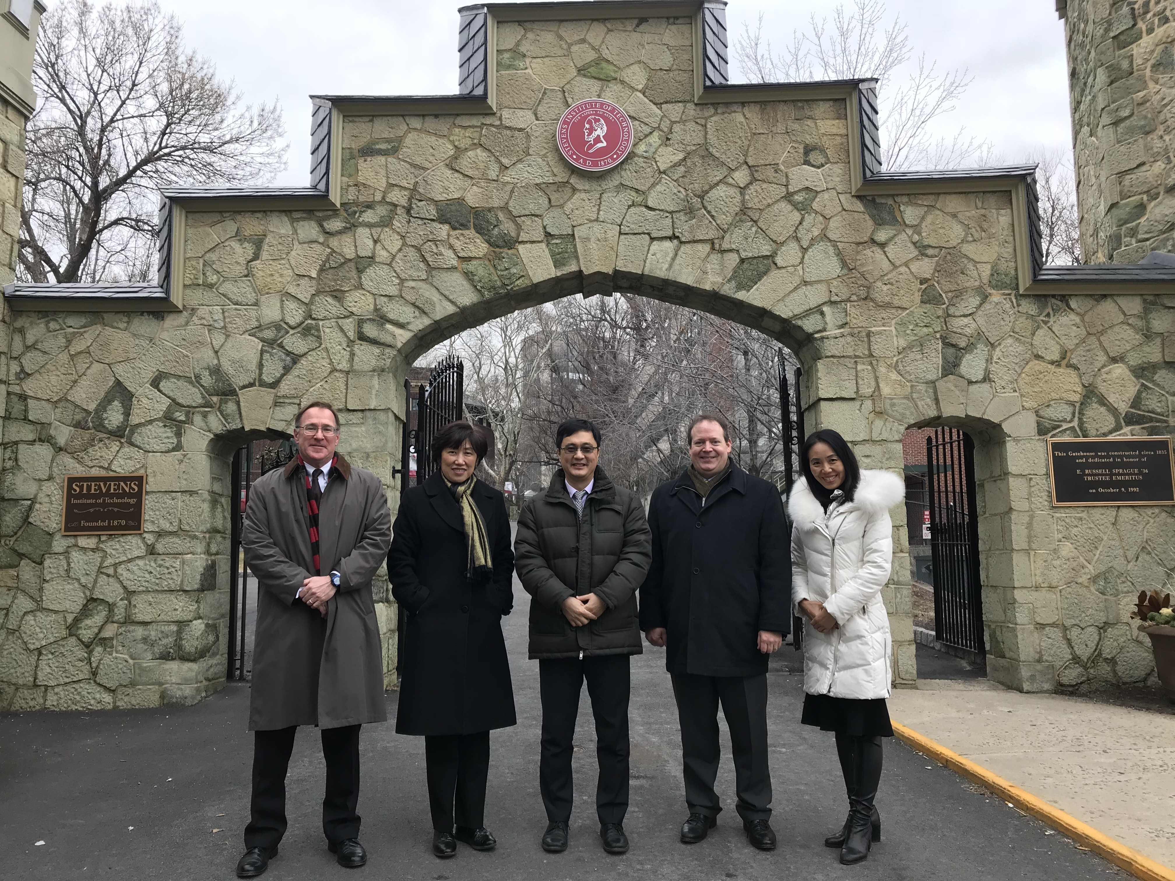 Stevens and Tsinghua Leadership Outside the Stevens Gatehouse. From Left to Right: Matt Libera, Jean Zu, Lin Zhang, Rainer Martini and Annie Song.