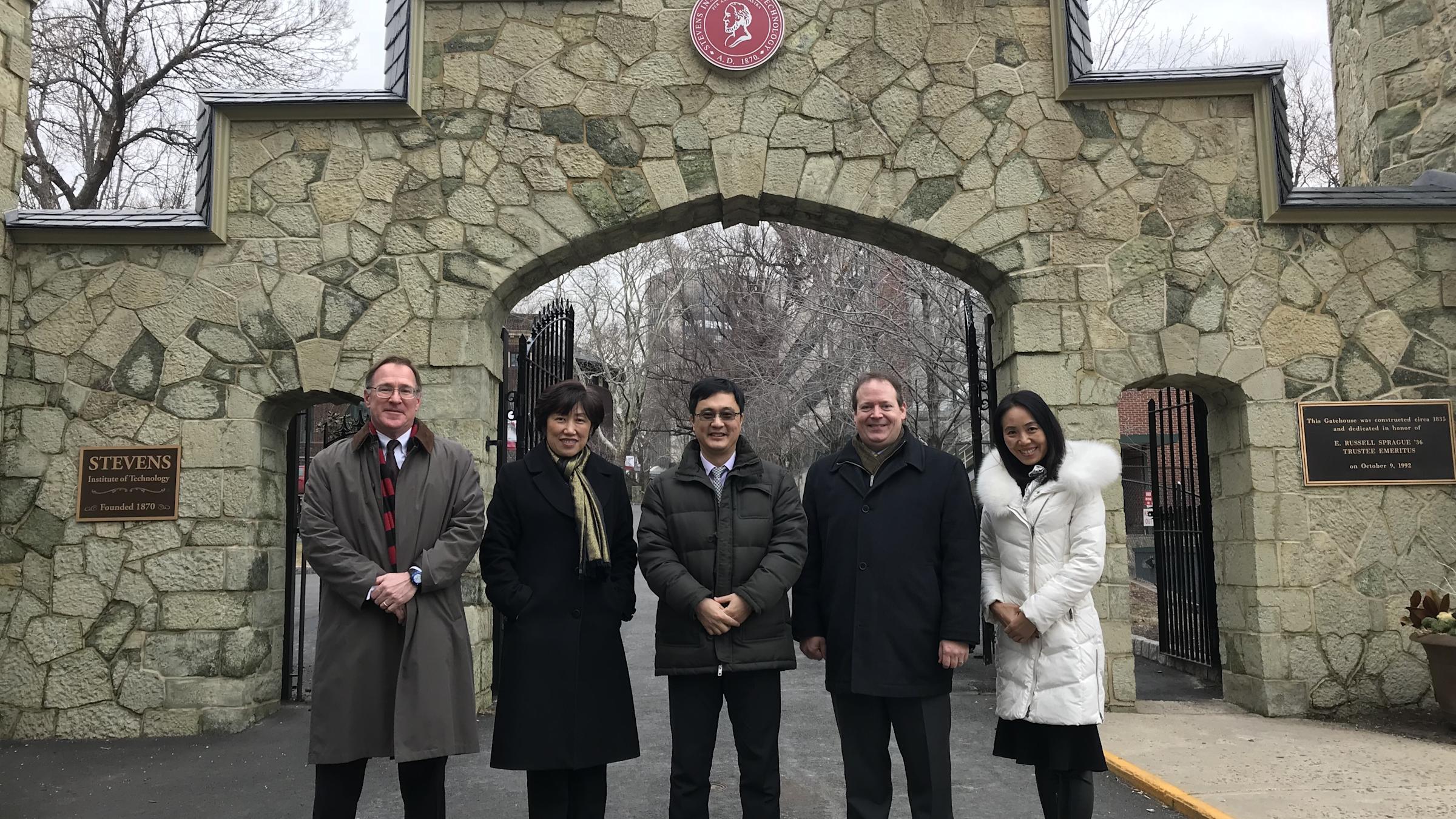 Stevens and Tsinghua Leadership Outside the Stevens Gatehouse. From Left to Right: Matt Libera, Jean Zu, Lin Zhang, Rainer Martini and Annie Song.