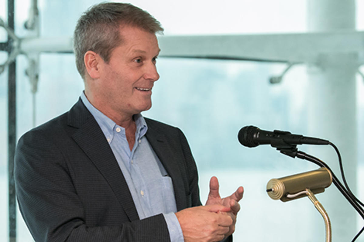 Scott Ross speaking at a podium at Stevens.