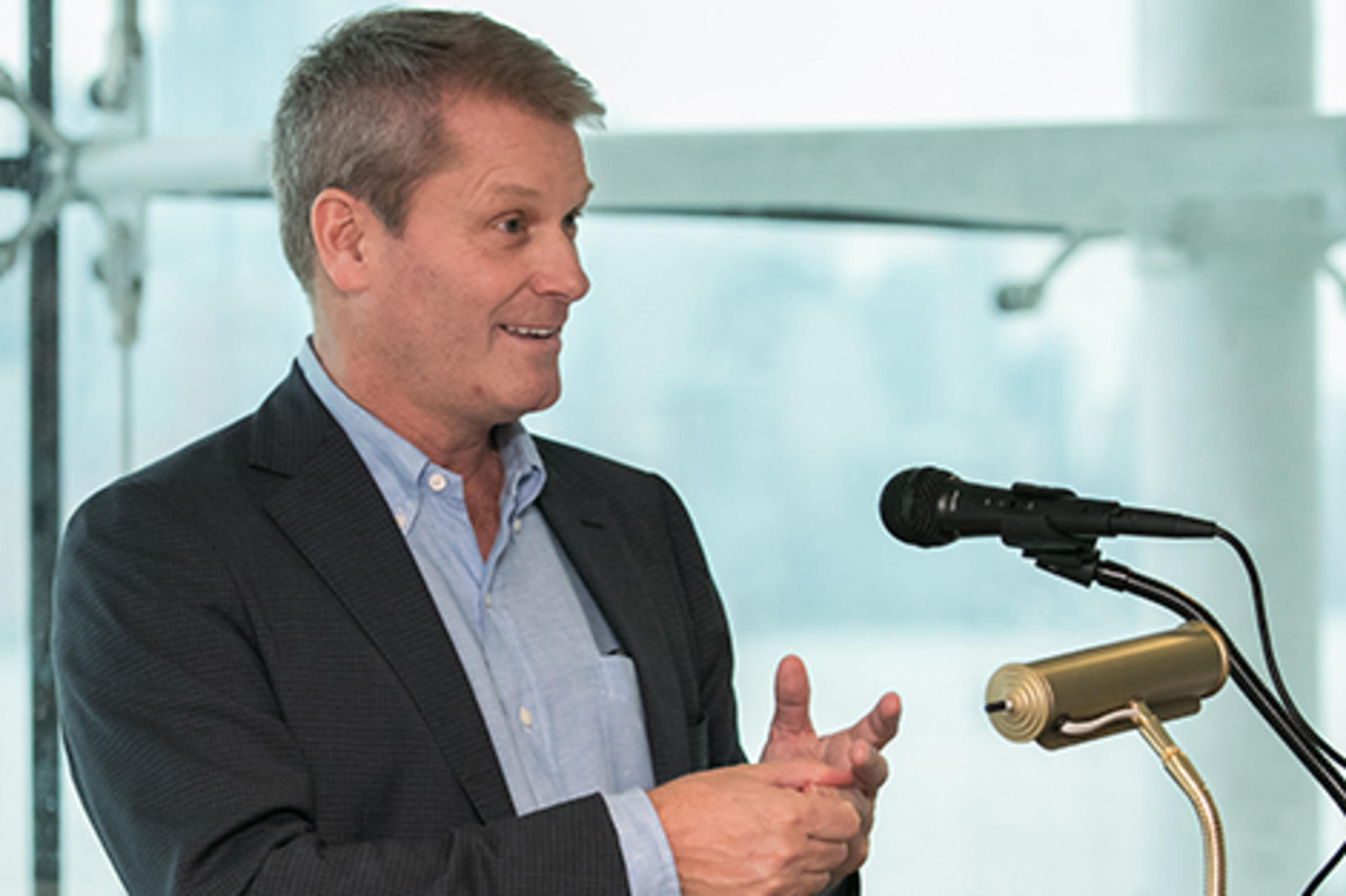 Scott Ross speaking at a podium at Stevens.