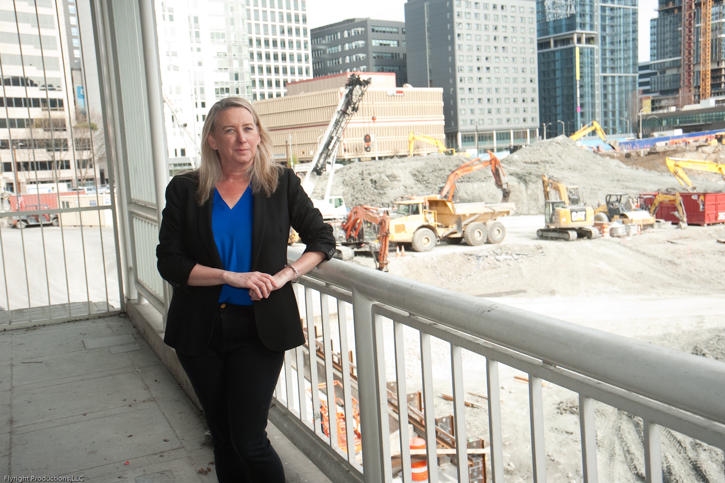 Twomey standing next to a construction site