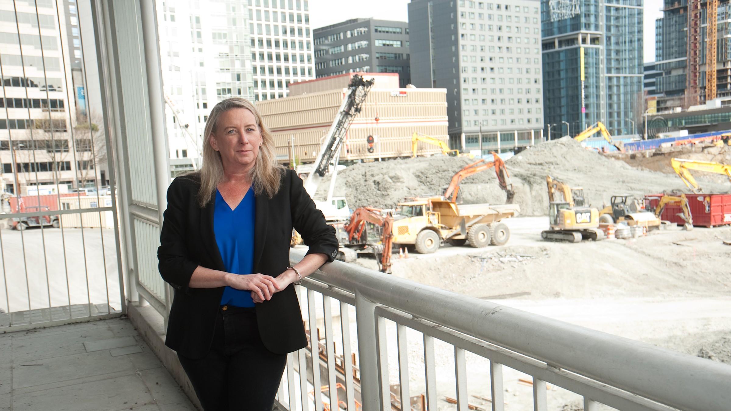 Twomey standing next to a construction site