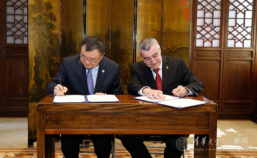 Photo of Dean Yang Bin and Provost Christophe Pierre signing a memorandum of cooperation.