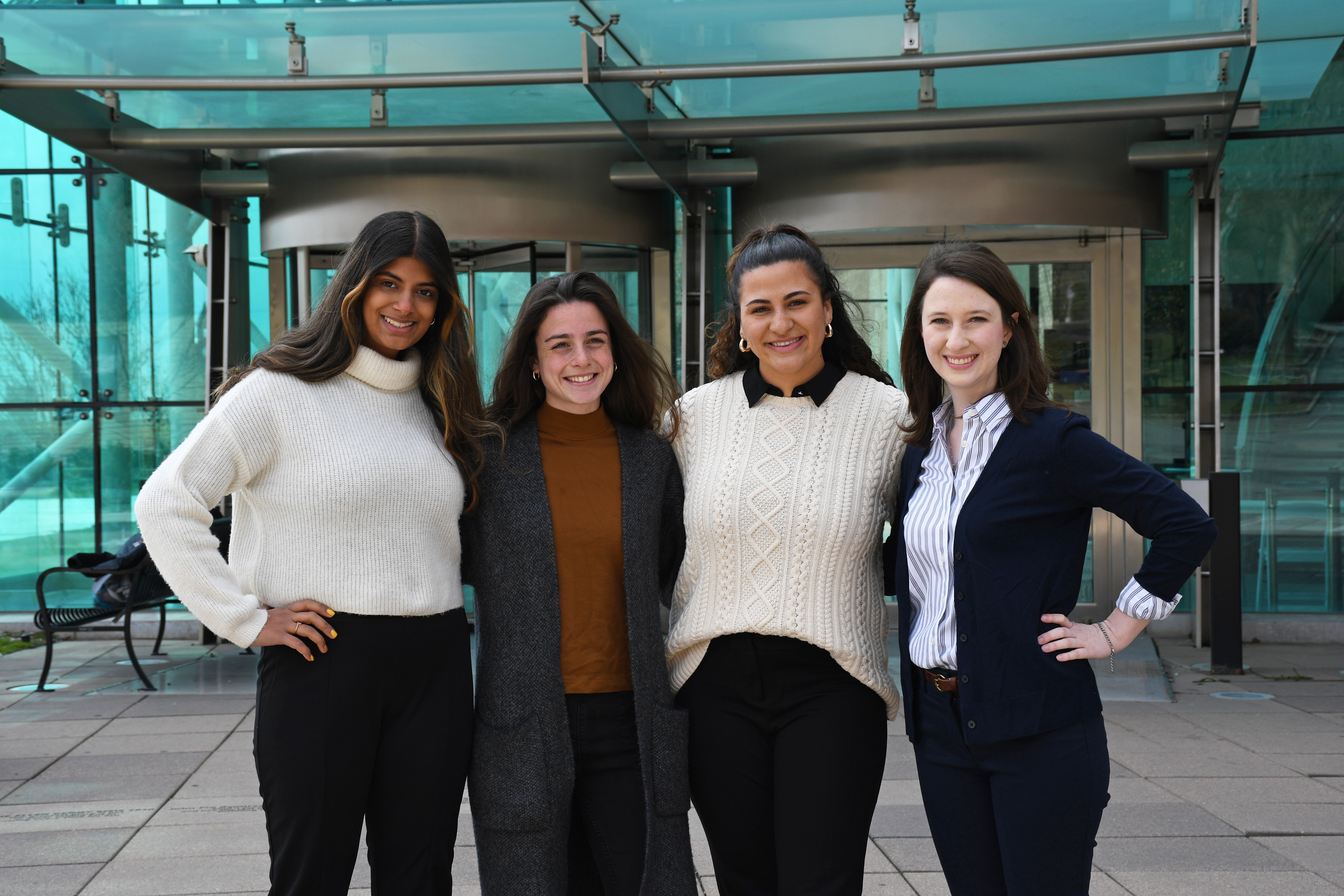 Four female students standing in front of Babbio Center.