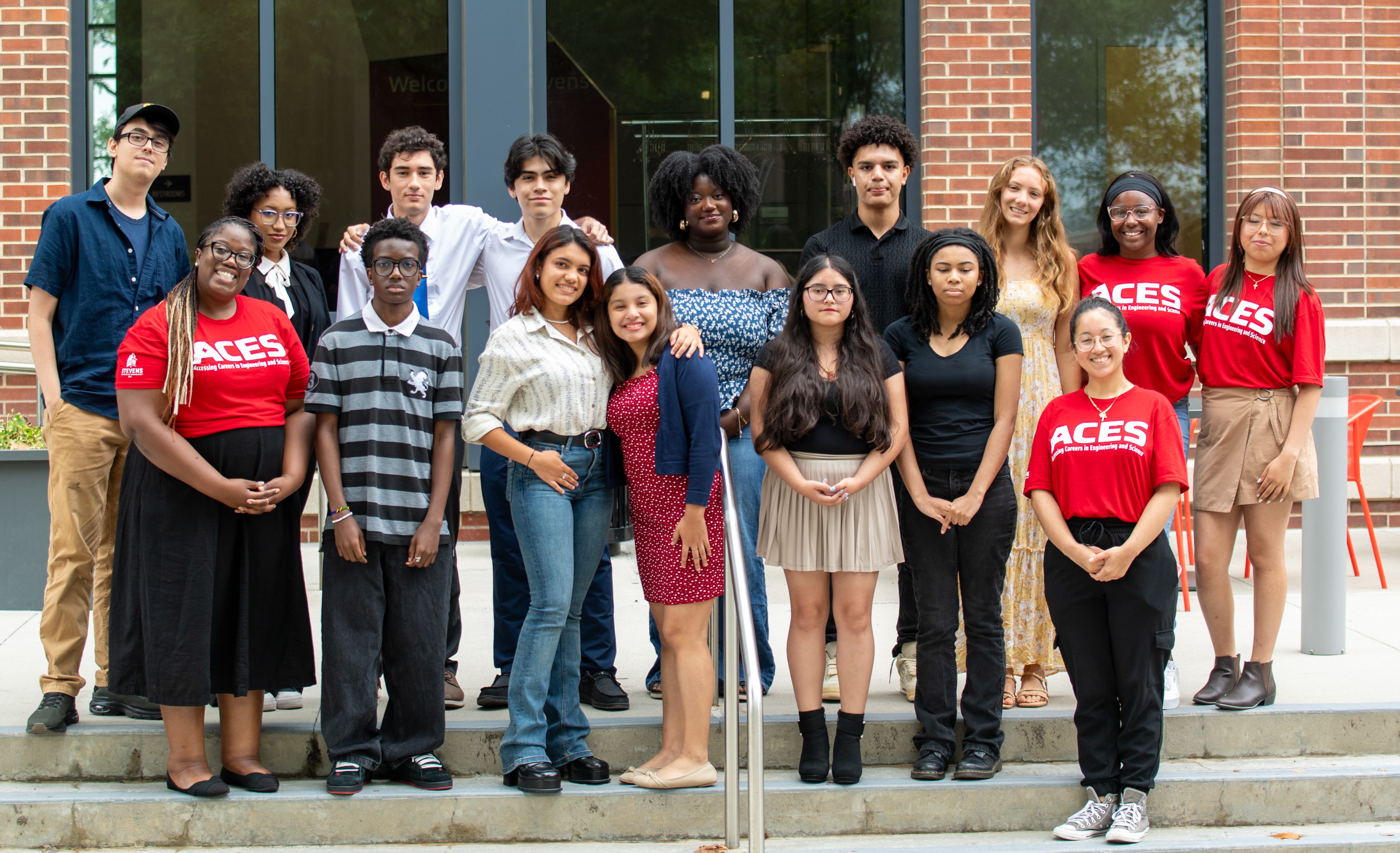 A group of people stand in front of a building.