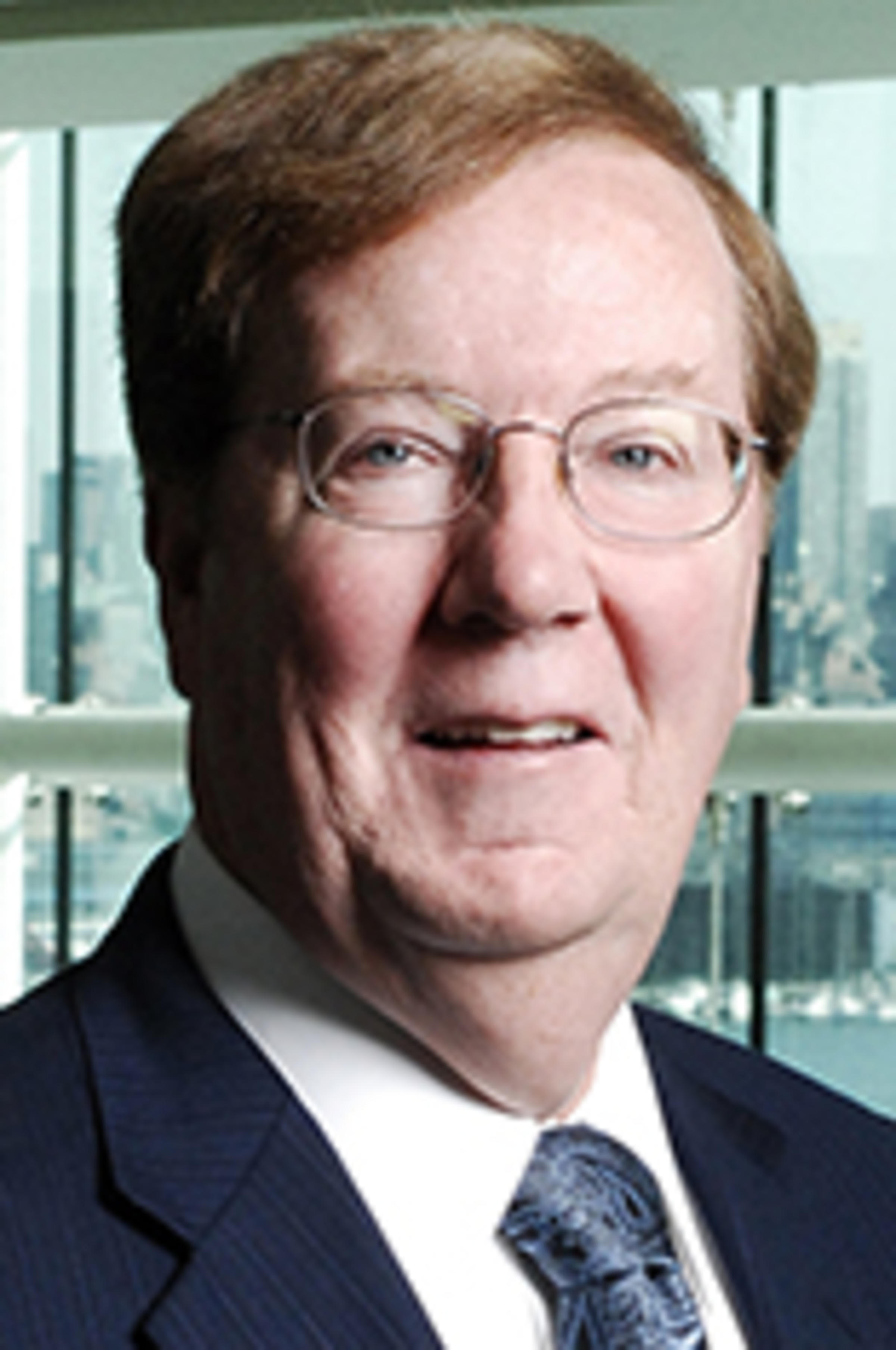 Headshot of Mike Parfett with the New York skyline in the background.