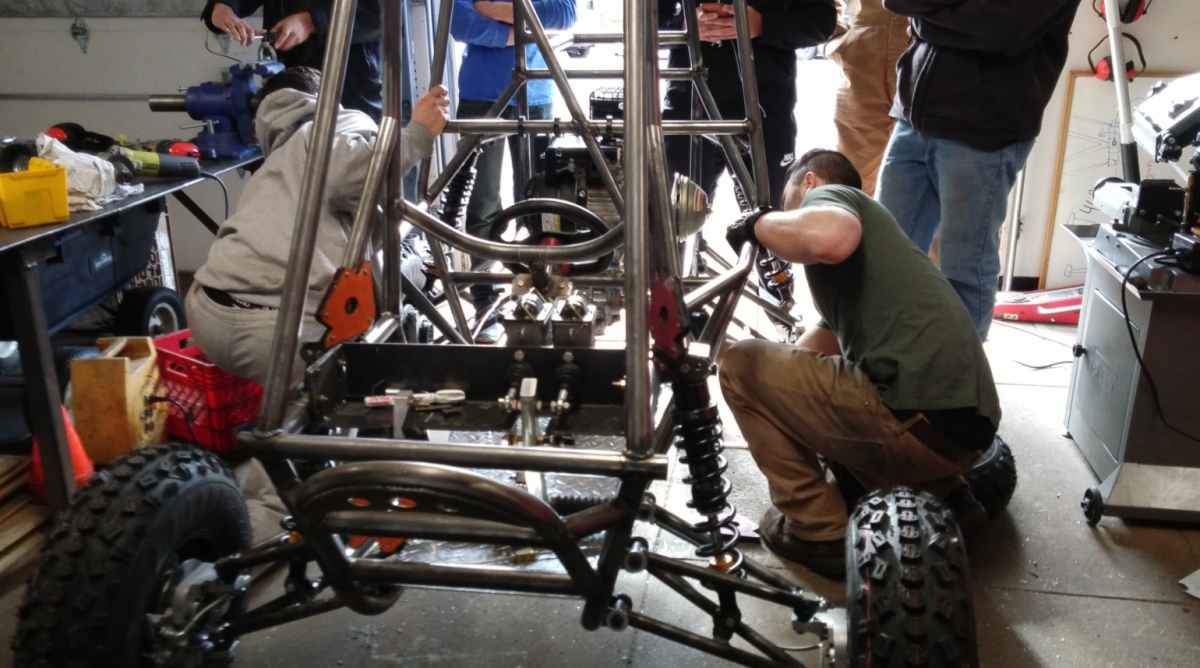 Farino and Raziano working on the car