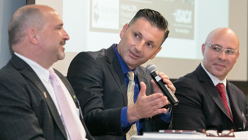 Three panelists answering questions during the FinCyberSec conference in Hoboken.