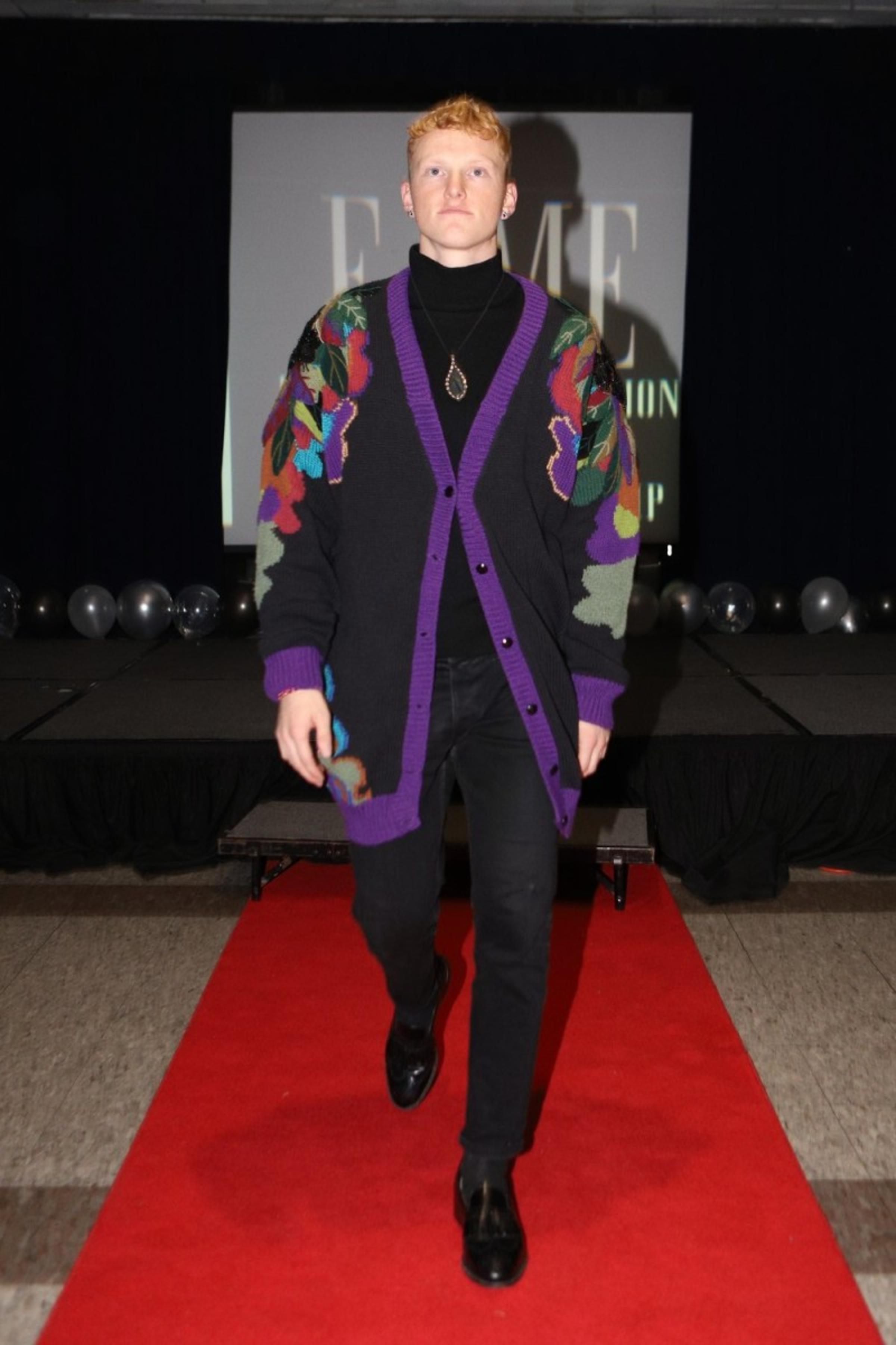 Student Travis Scott walking in the Fall 2021 Fashion Show.