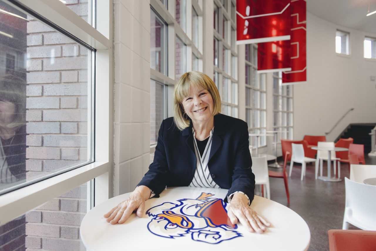 Coach Linda Vollkommer-Lynch sitting at a table