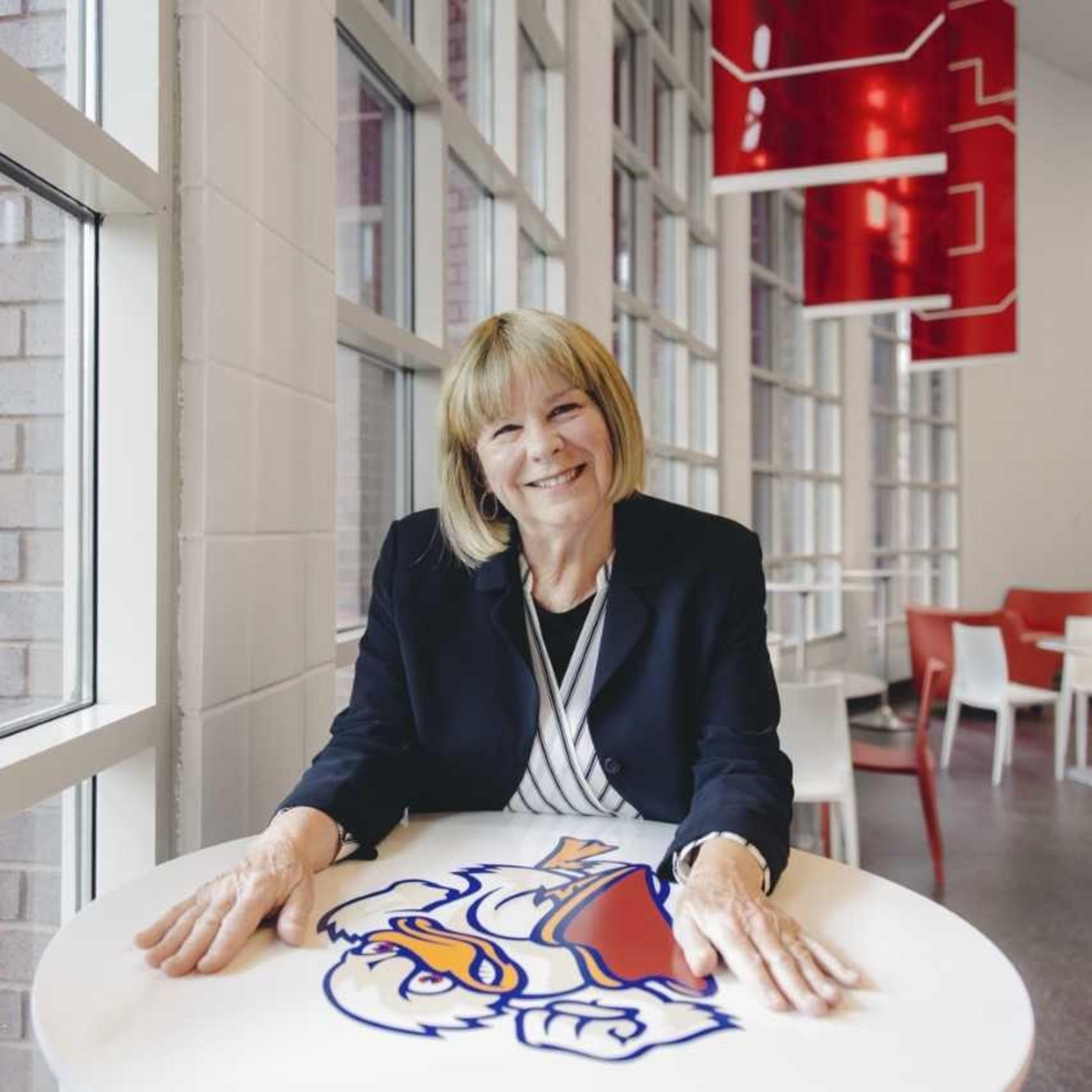 Coach Linda Vollkommer-Lynch sitting at a table