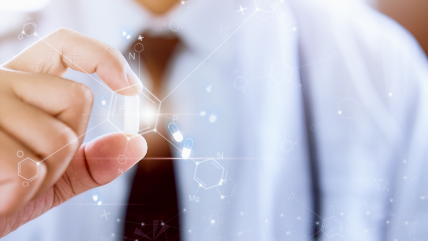 Image of man manipulating digital chemical diagram