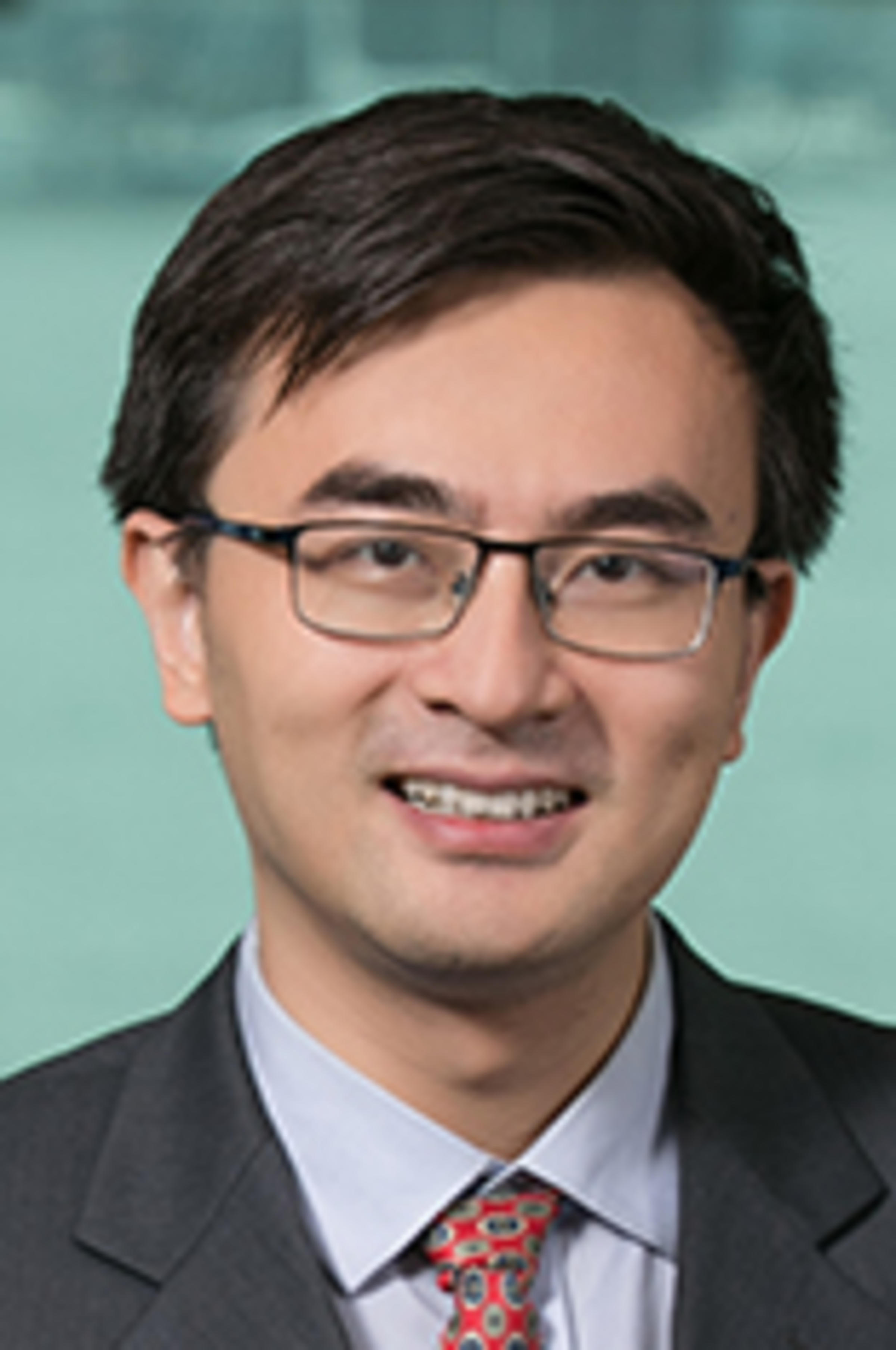 Dr. Zhenyu Cui with the Manhattan skyline in the backdrop.