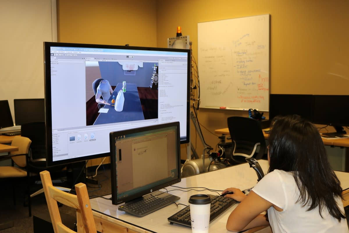 Patel sets up the virtual reality environment.