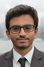 Headshot of Jeet Kothari with New York City visible in the background.