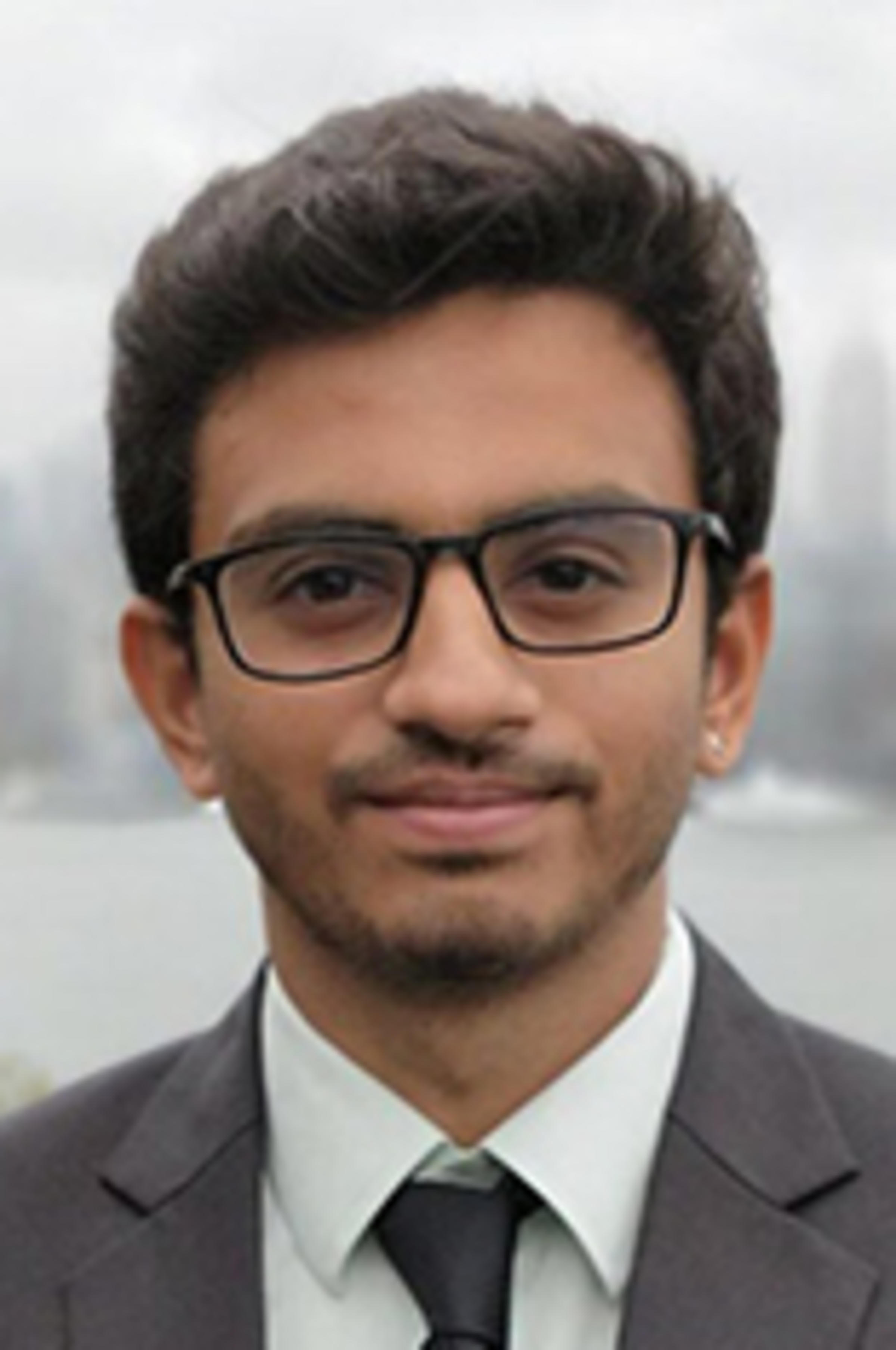 Headshot of Jeet Kothari with New York City visible in the background.