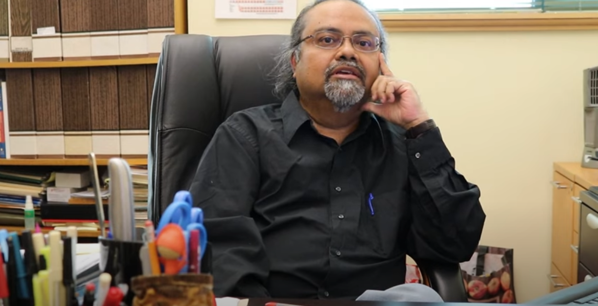 Dibs Sarkar sitting at a desk