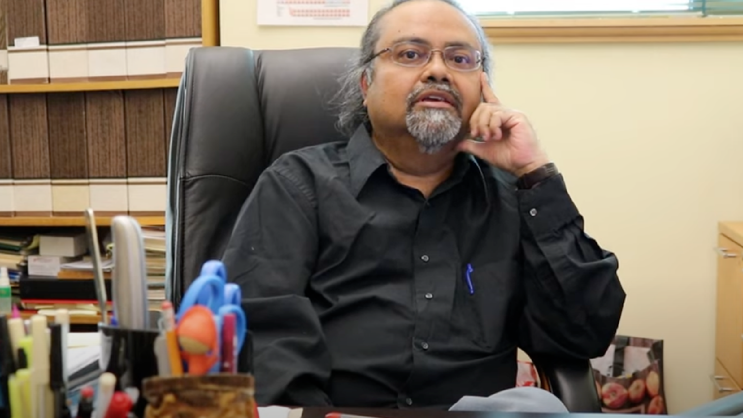 Dibs Sarkar sitting at a desk