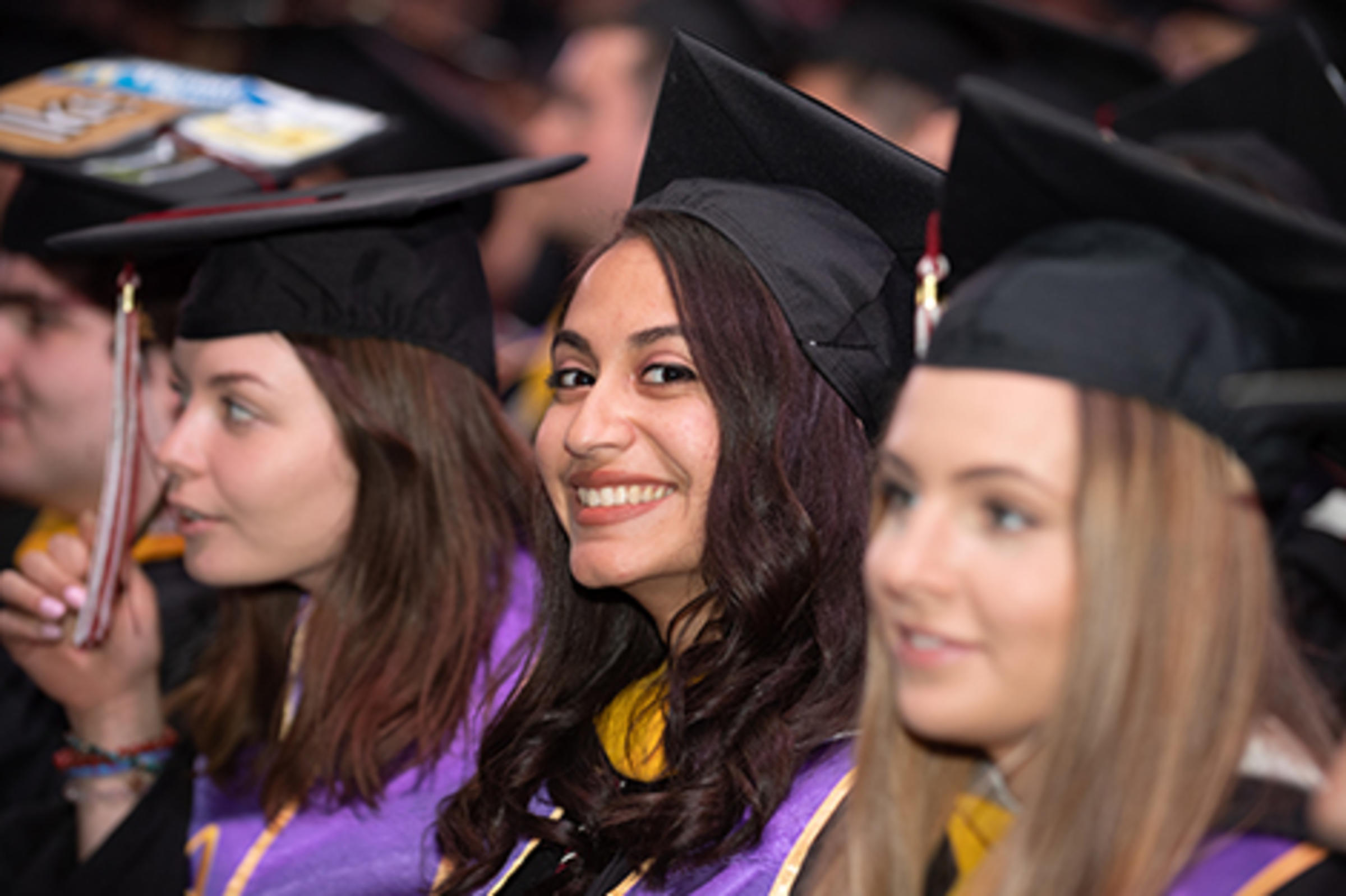 Sheila De Assis in her cap and gown at commencement.