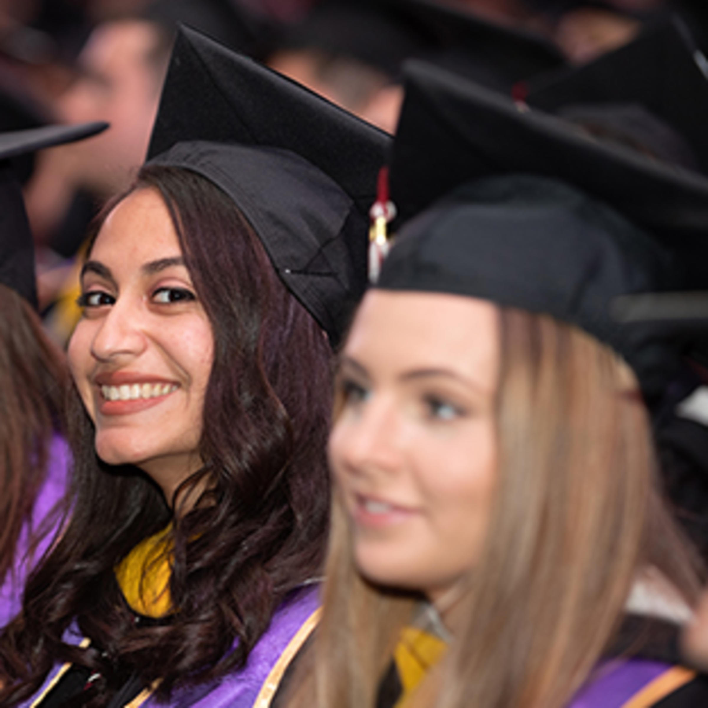 Sheila De Assis in her cap and gown at commencement.