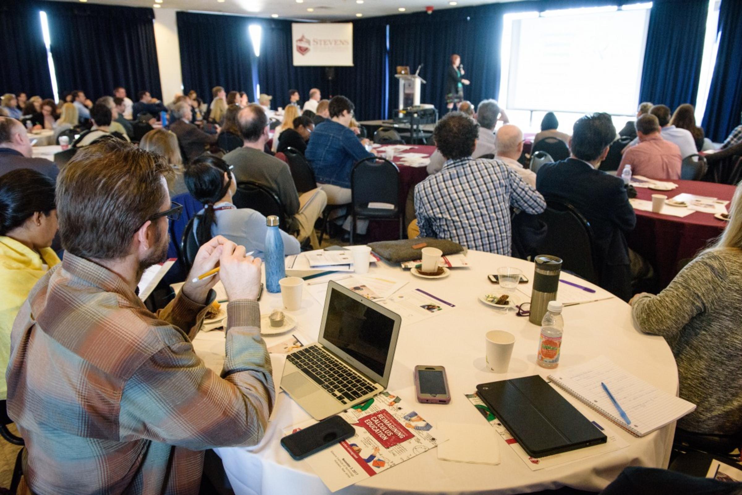 Conference attendees watching a speaker