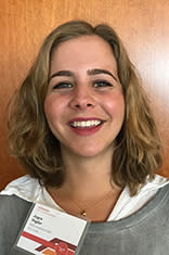 Headshot of Joyce Pegler in a white dress shirt with a gray cardigan.