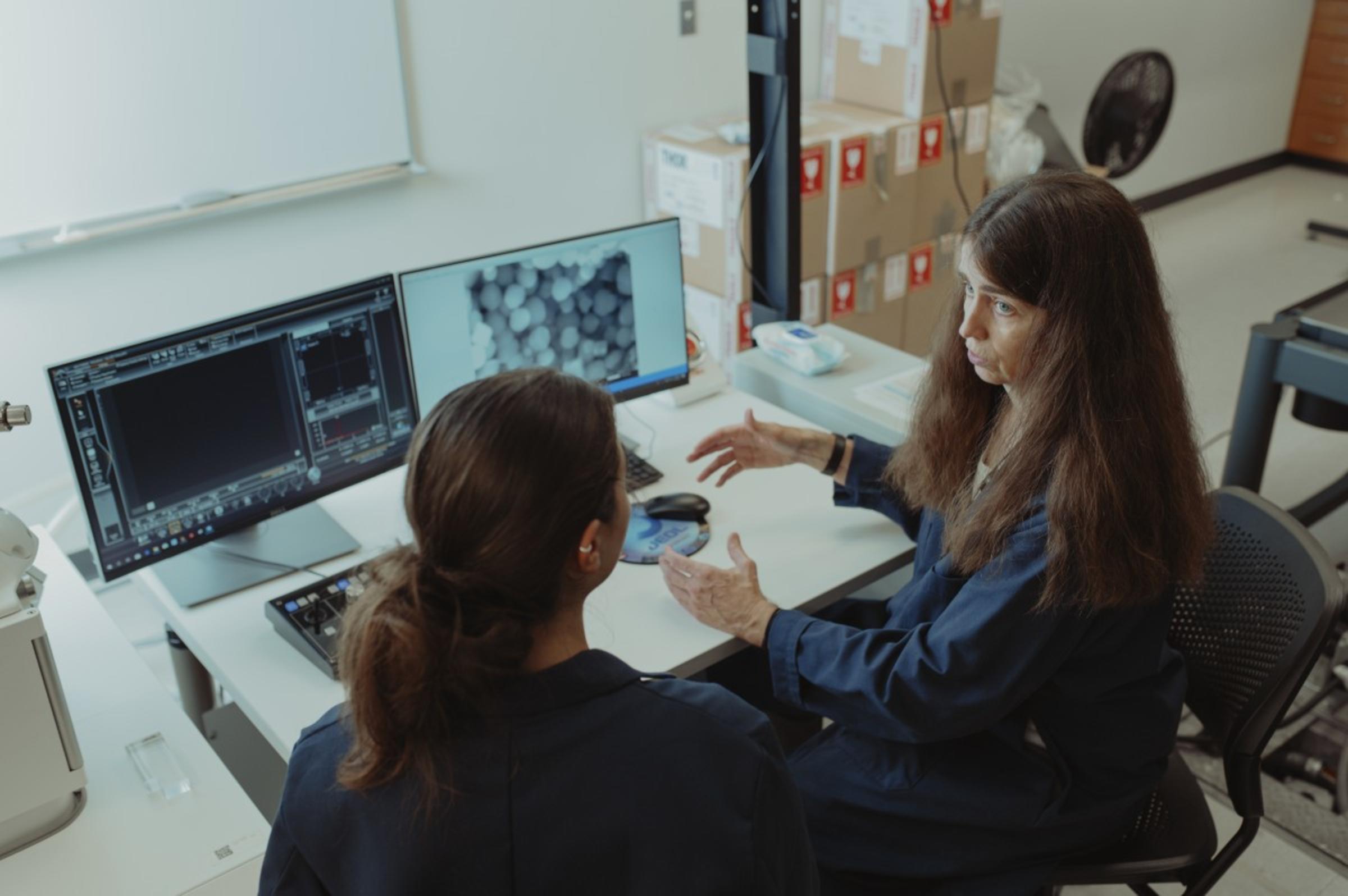 Duncan, conferring with a student at West Point