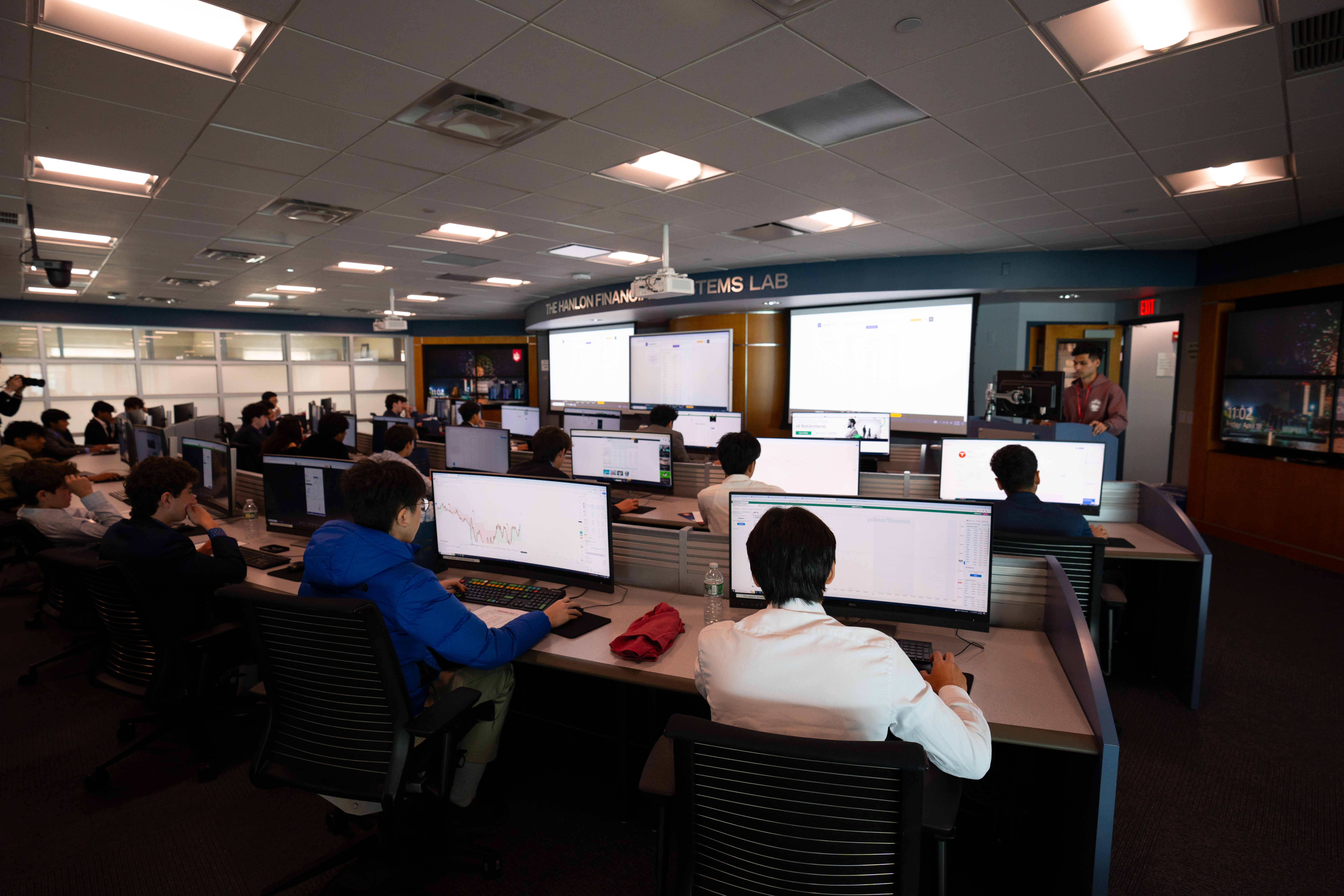 Participants in the trading day competition sit in front of their computer terminals inside the Hanlon Financial Systems Lab.