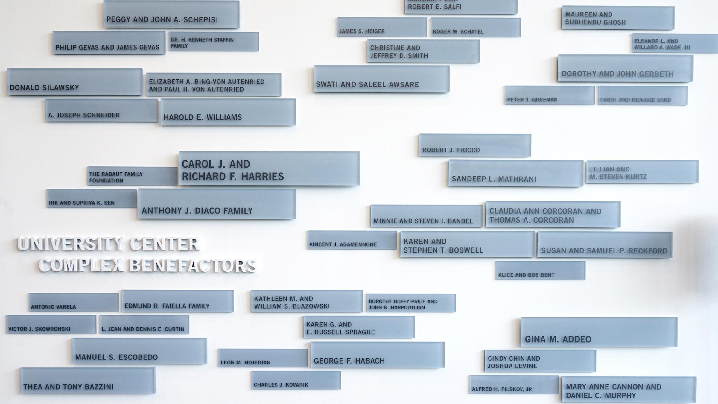 Plaques listing donors on the wall of the UCC.